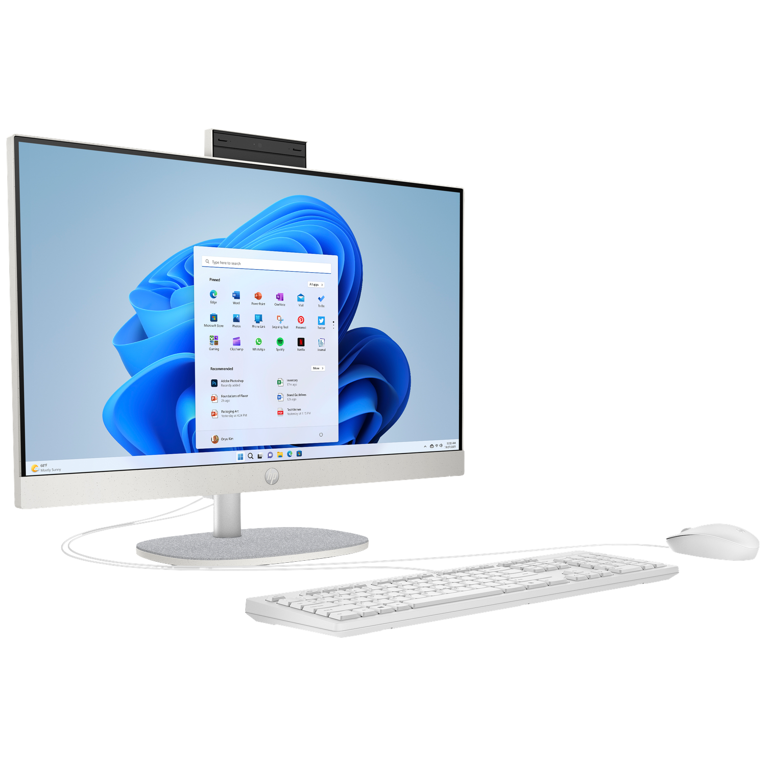 A white all-in-one computer with keyboard and mouse on a white desk.