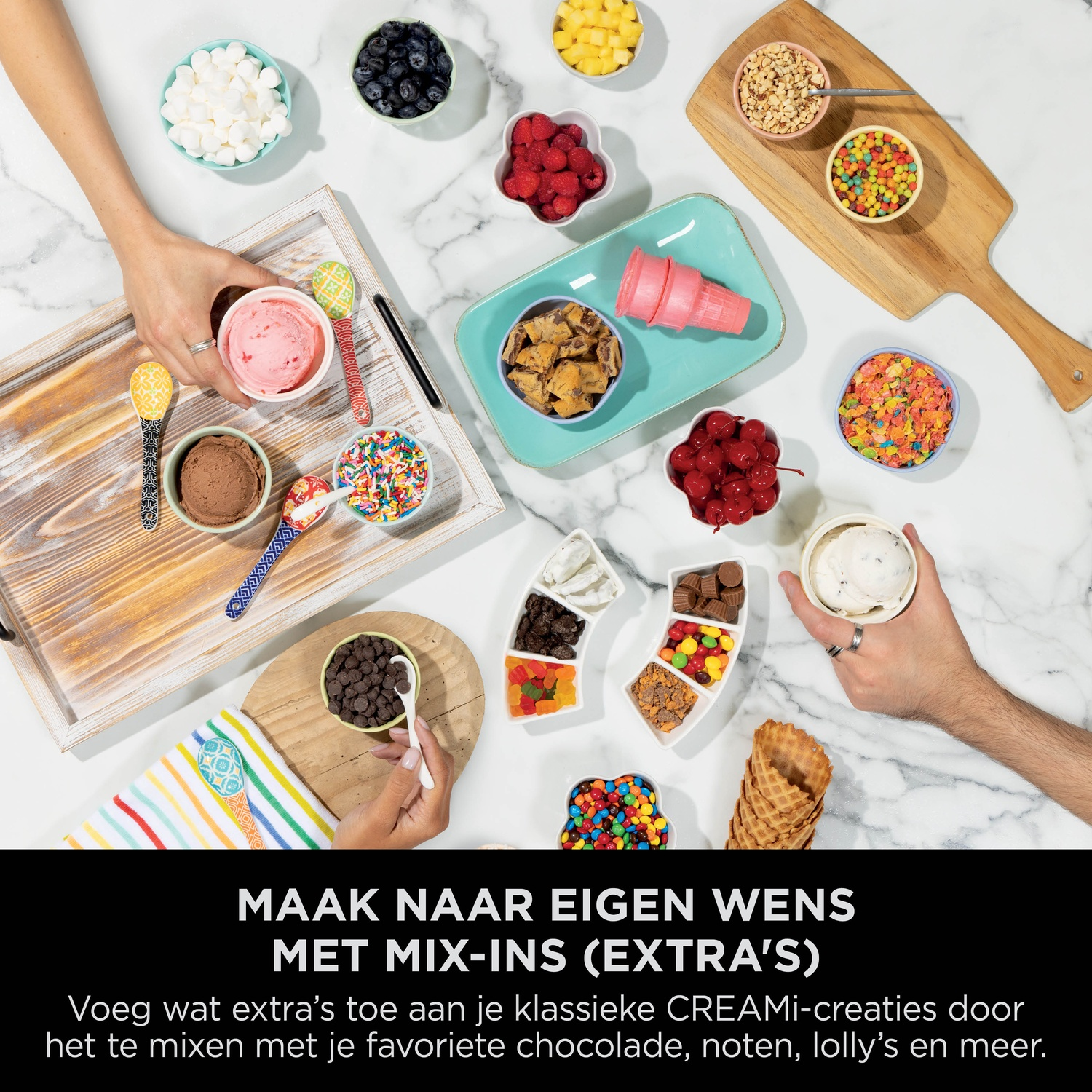 Ice cream and toppings like marshmallows, berries, nuts, and candies are displayed.