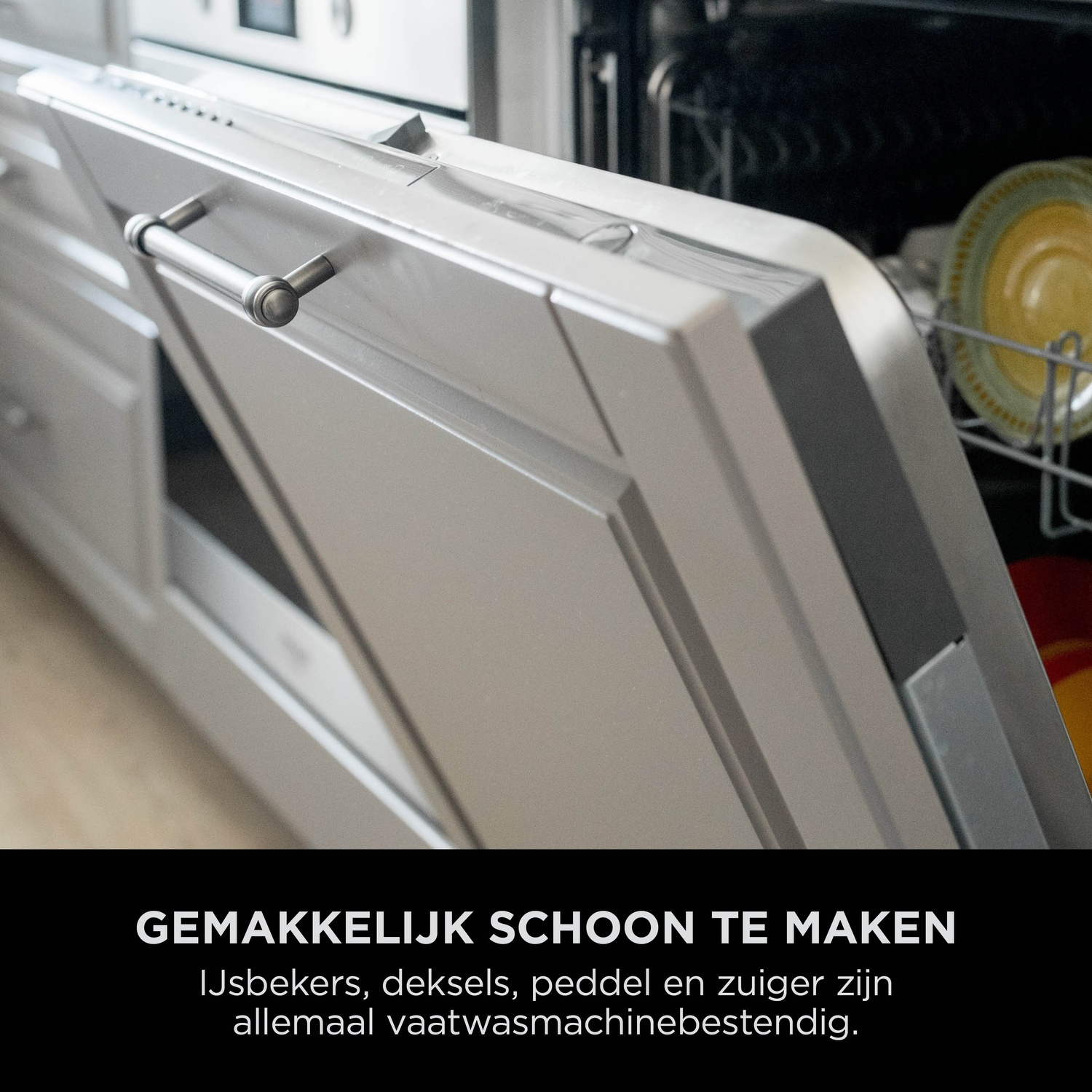 Dishwasher with open door, yellow and green plates visible inside.