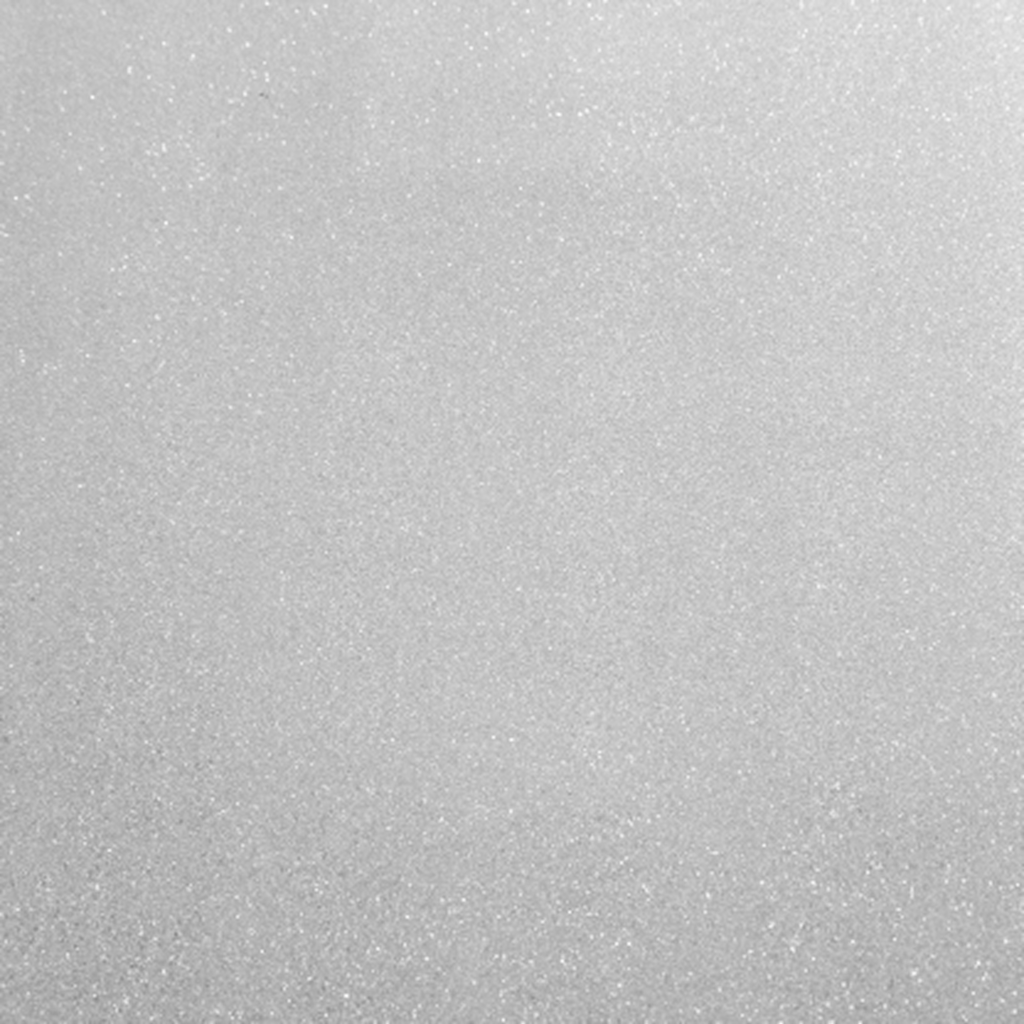 Un primer plano de material blanco y brillante que parece nieve o azúcar.