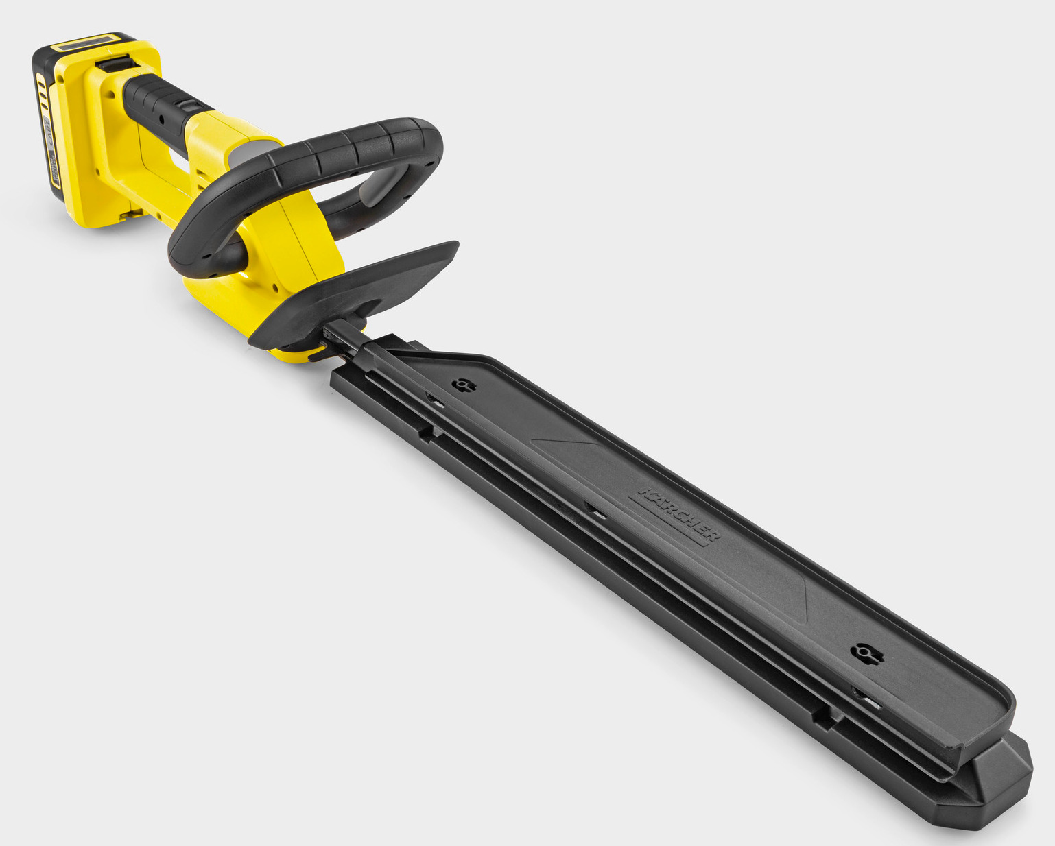 Żółte akumulatorowe nożyce do żywopłotu z czarnym uchwytem i ostrzami.