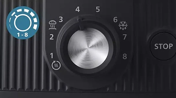 Zbliżenie pokrętła z numerami od 1 do 8. Ikony wskazują ustawienia, np. tost i mrożenie.