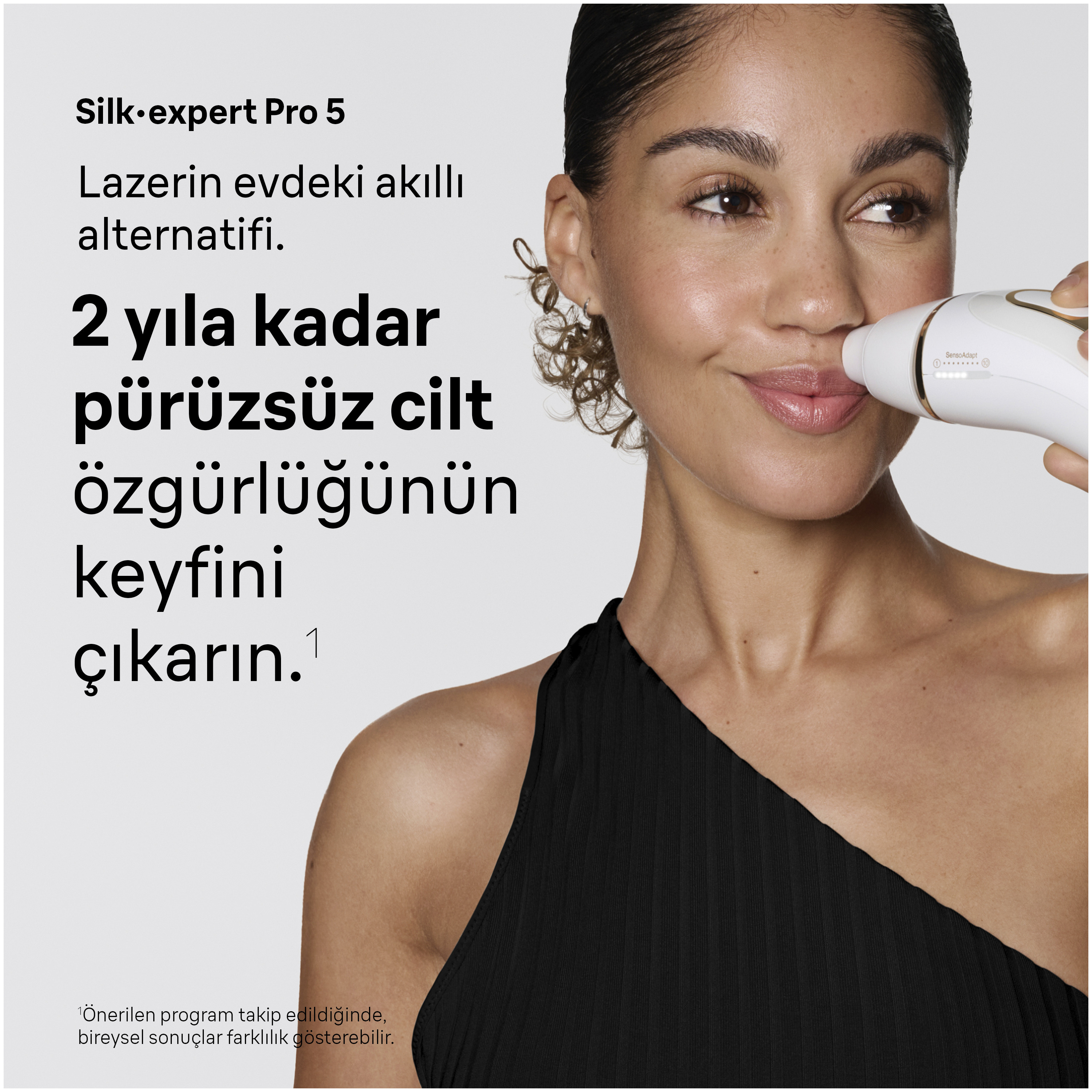 Kadın yüzünde epilatör kullanıyor. Türkçe metin.