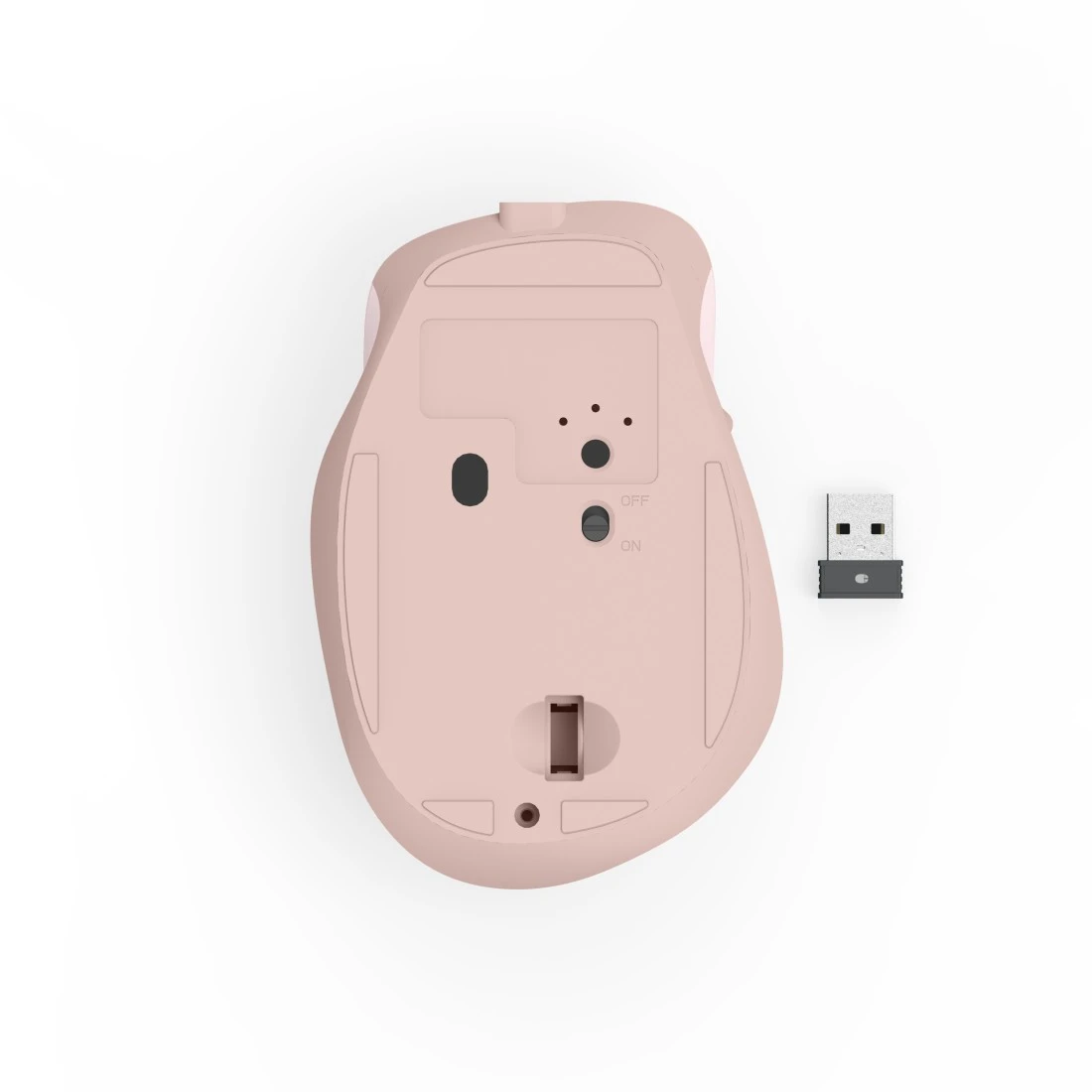 Różowa mysz komputerowa widok od spodu z odbiornikiem USB. Widoczny włącznik.