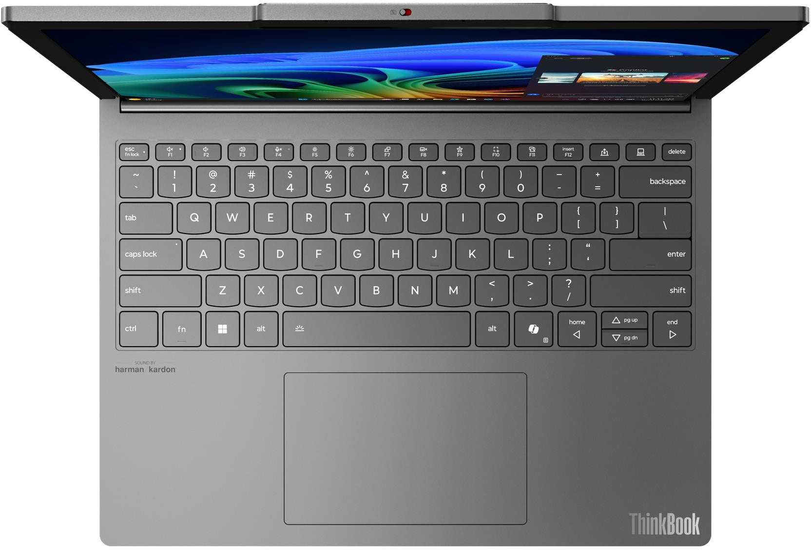Nyitott laptop billentyűzetet, érintőpadot és színes absztrakt háttérképes képernyőt mutat.