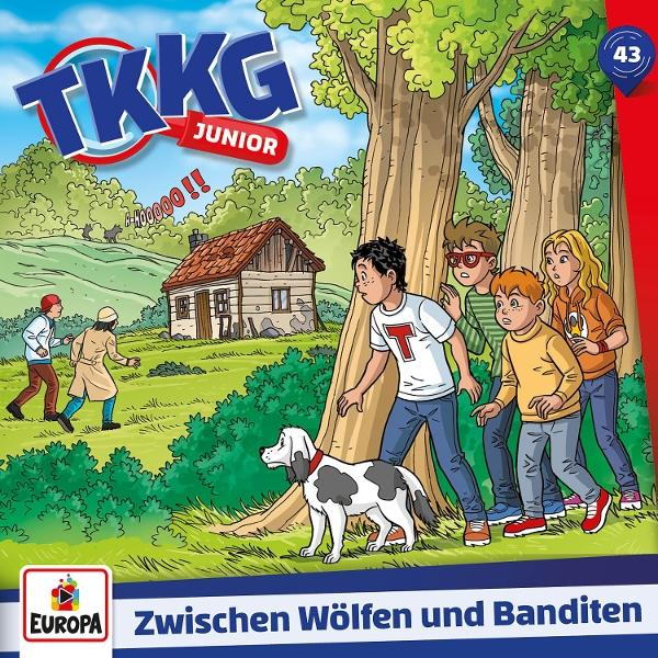 Kinder und Hund verstecken sich hinter Bäumen vor einem alten Haus mit Wölfen.
