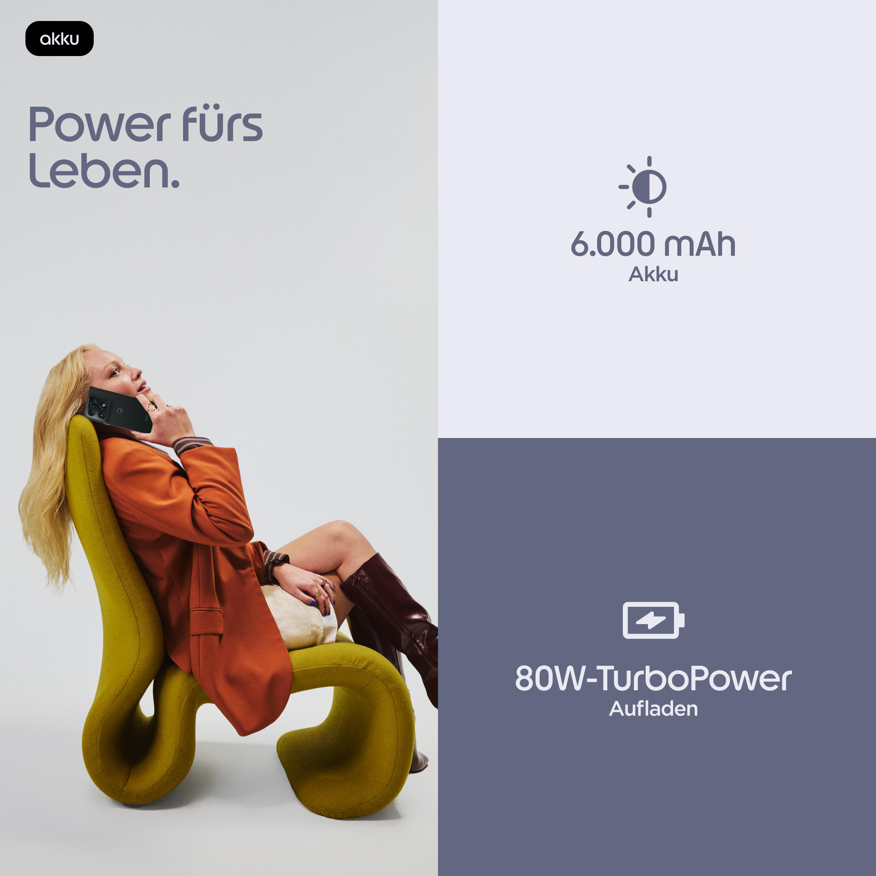 Frau mit Handy auf einem gelben Stuhl. 6000 mAh Akku und 80W TurboPower.