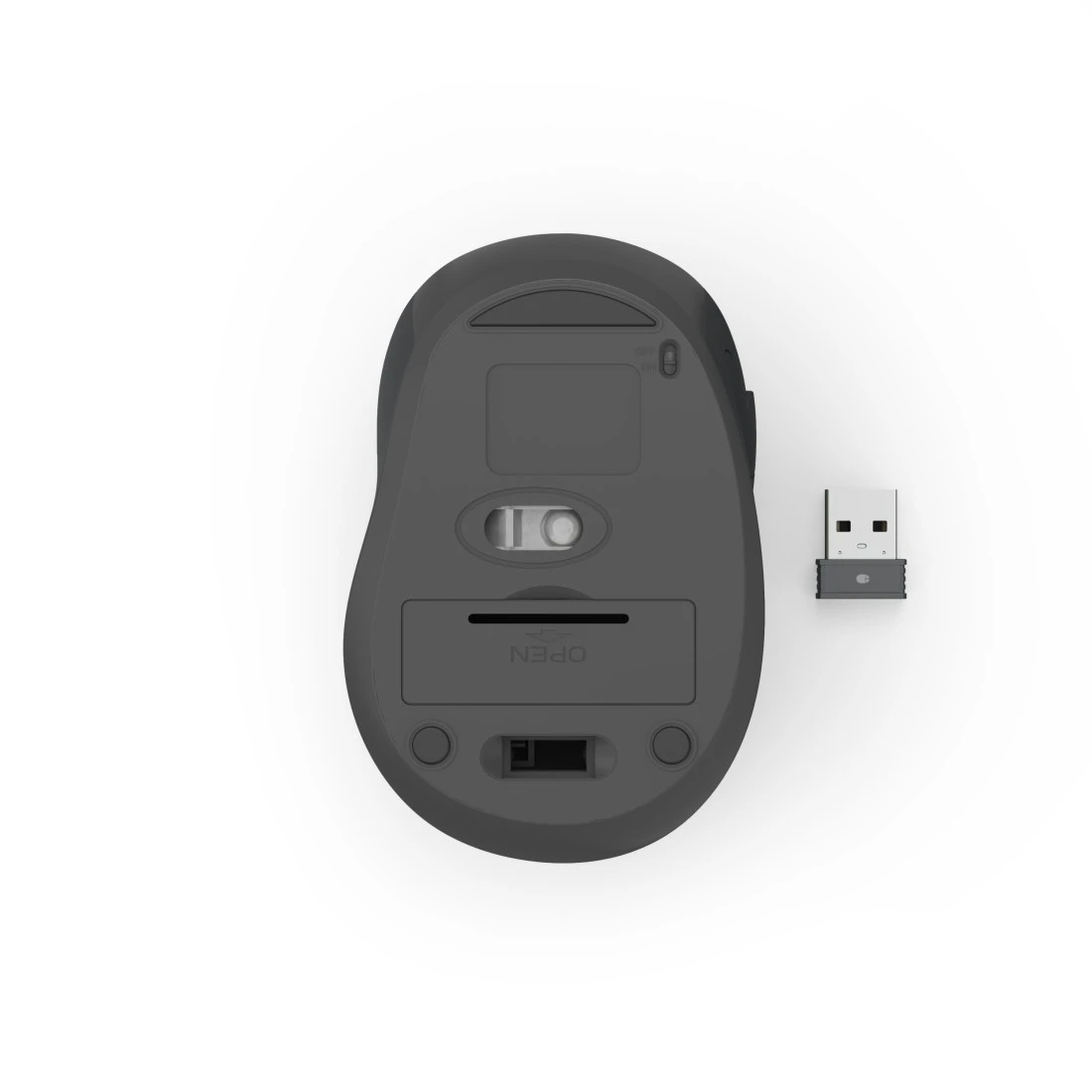 Spód ciemnej myszy z odbiornikiem USB obok.