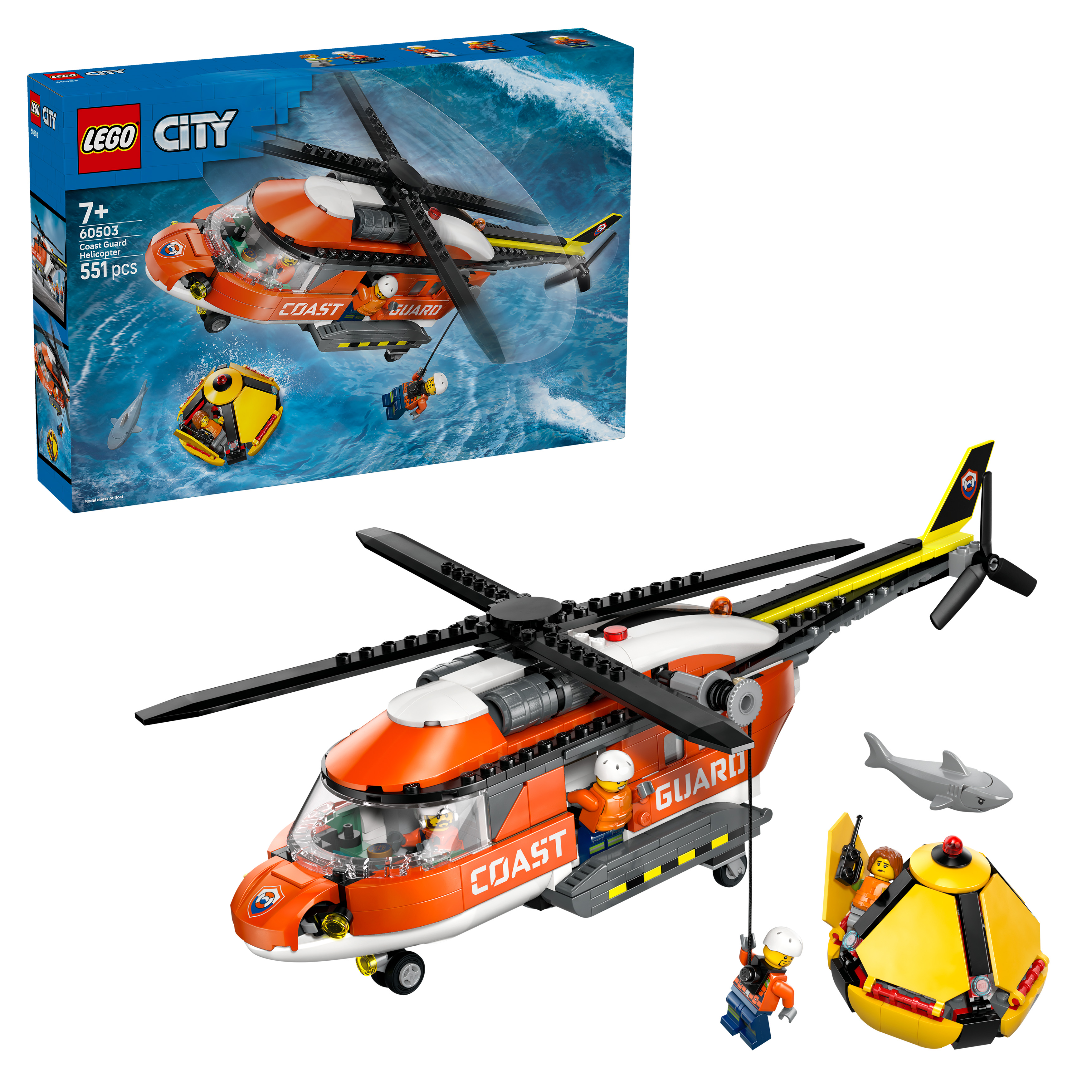 Pomarańczowy helikopter straży przybrzeżnej z żółtą kapsułą ratunkową, rekinem i figurkami.