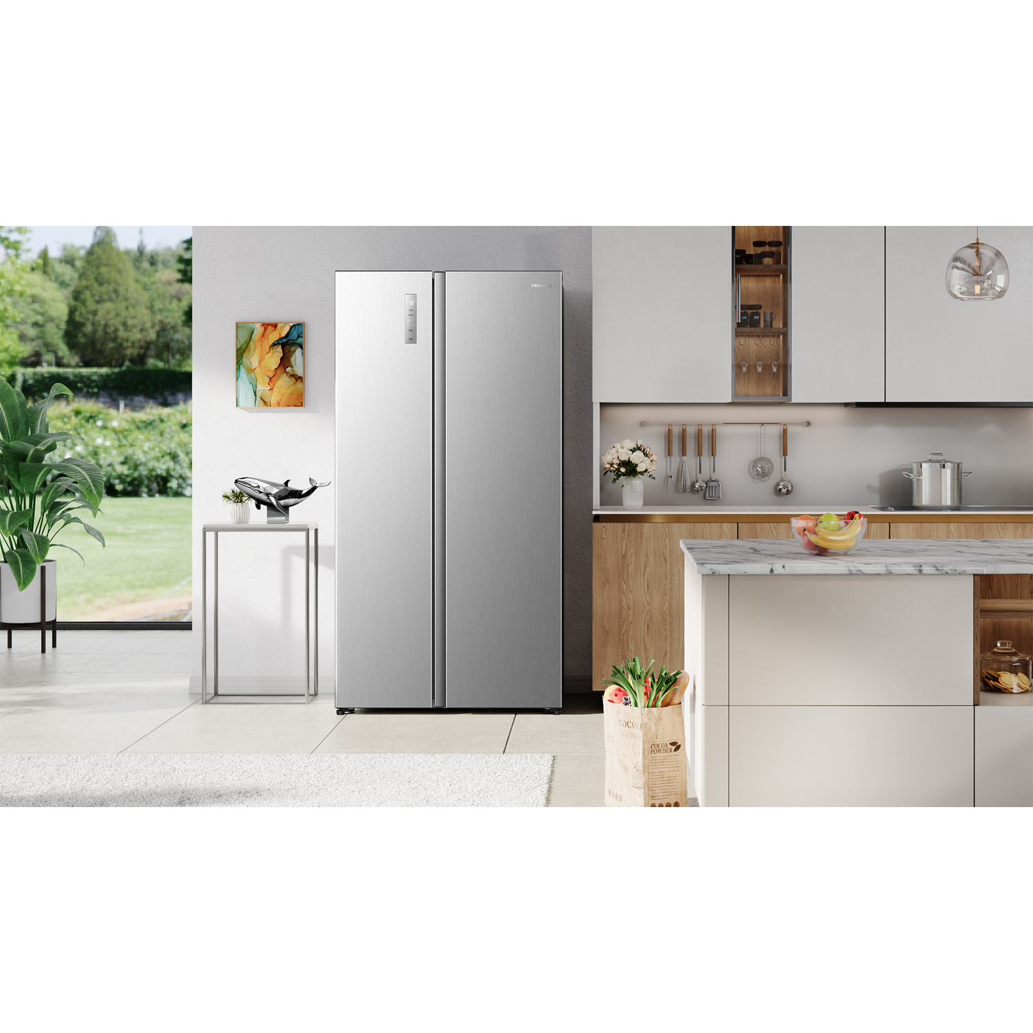 A silver refrigerator stands in a modern kitchen overlooking a garden.
