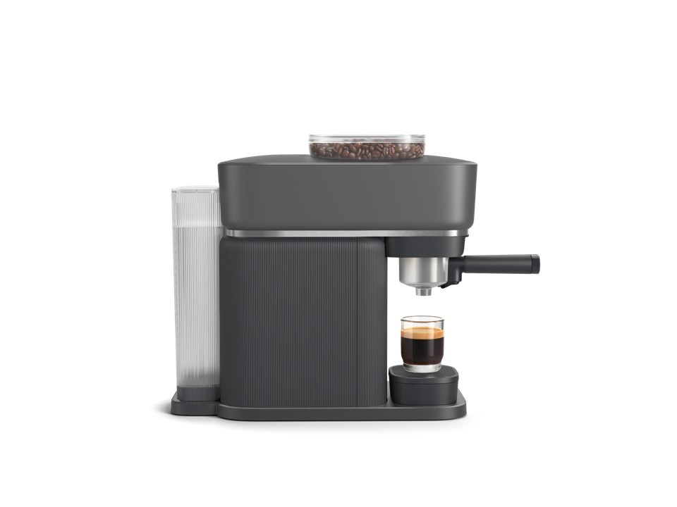 Cafetera gris con depósito de granos, depósito de agua y un espresso en vaso.