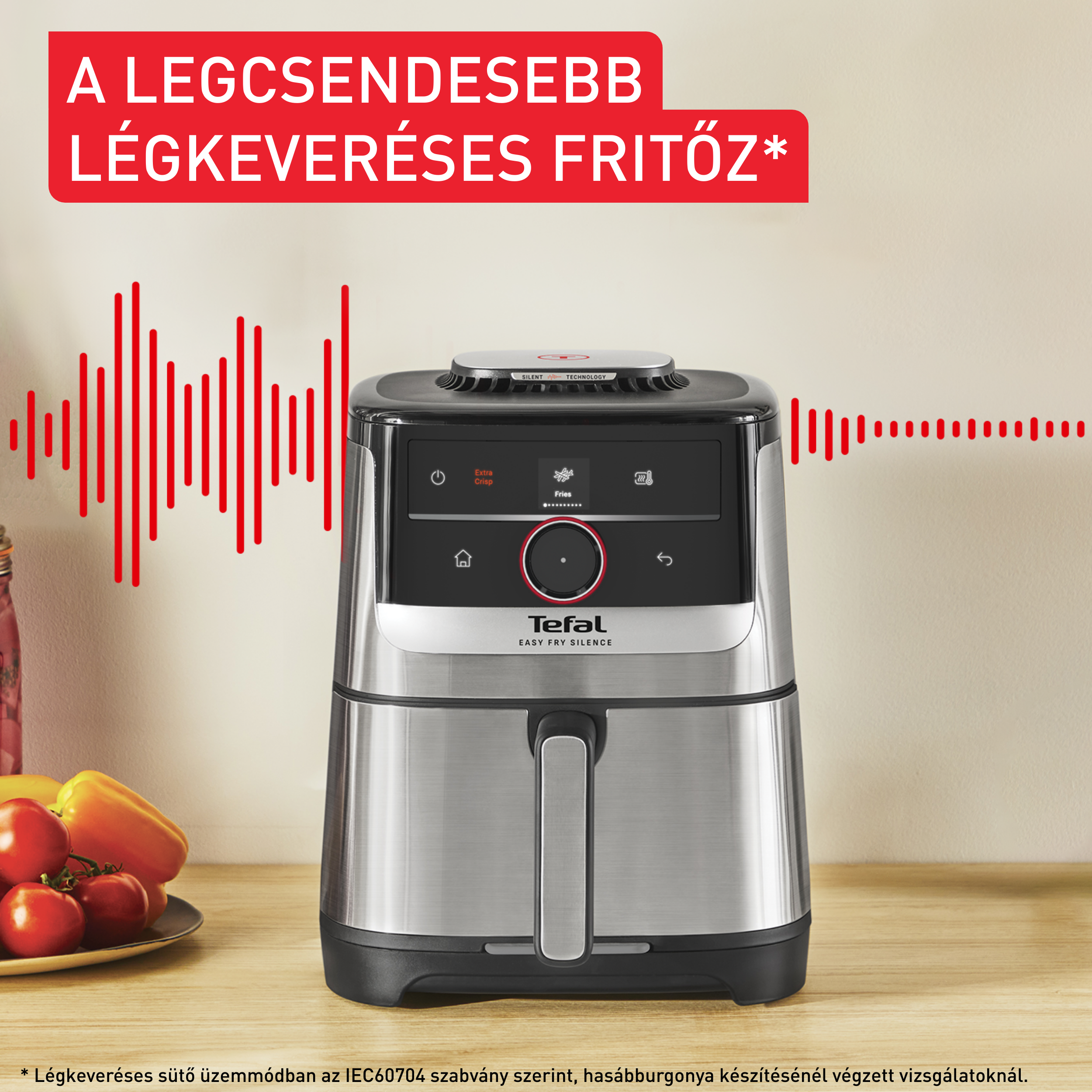 Ezüst színű légkeveréses fritőz, piros felirattal: "A legcsendesebb légkeveréses fritőz".