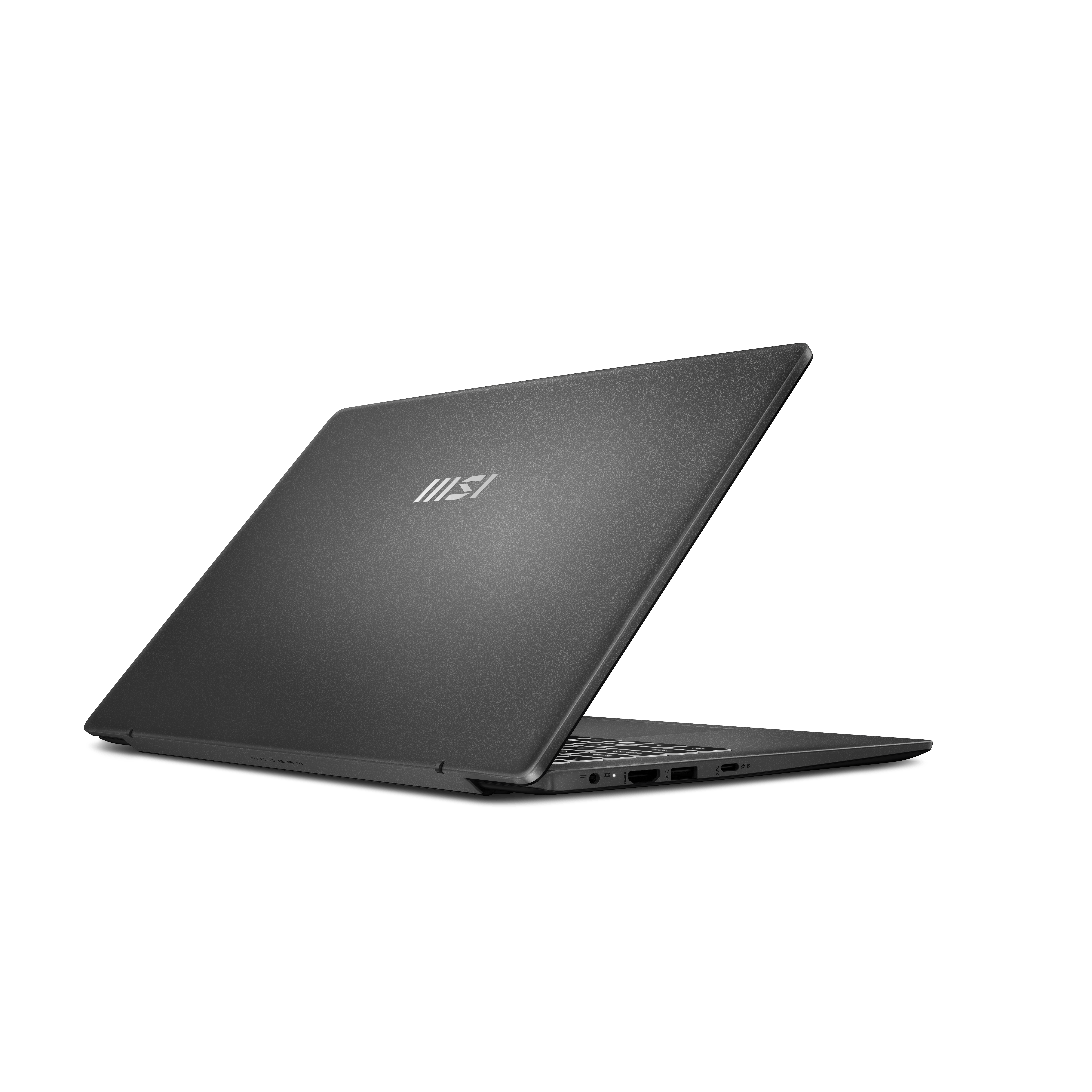 Un ordinateur portable fermé et sombre avec le logo MSI sur le capot.