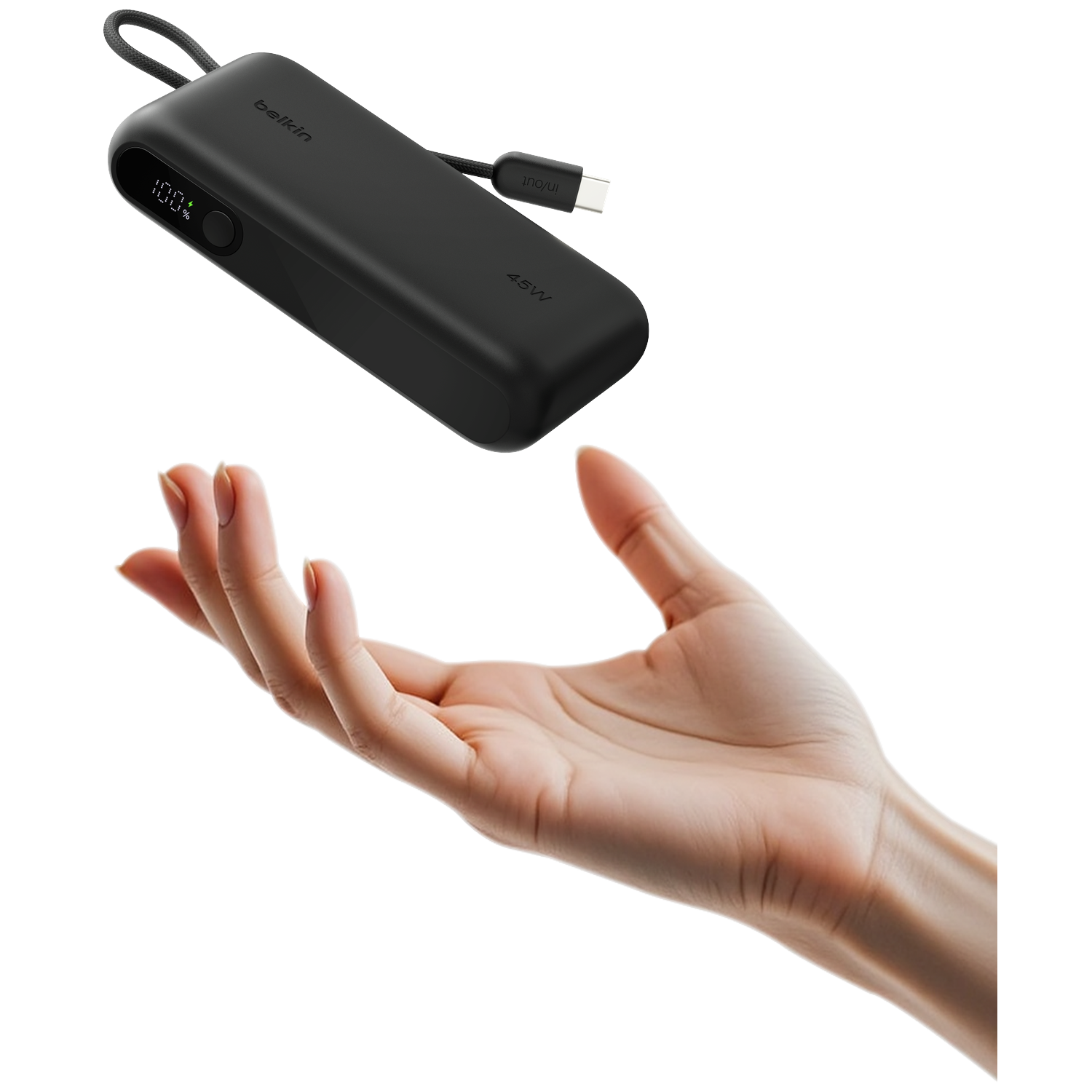 Black Belkin power bank with USB-C cable hovers above an open hand.