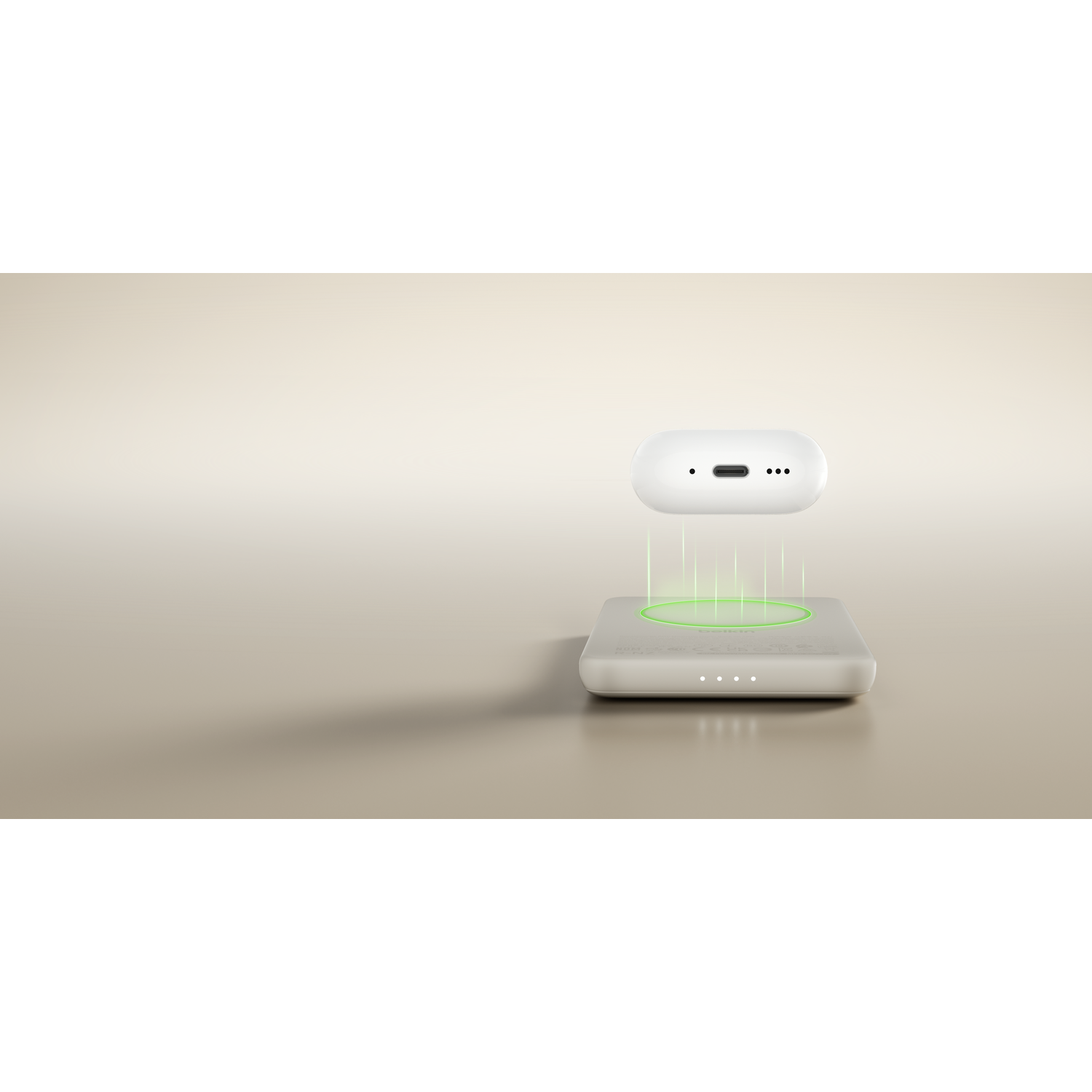 A white wireless charger with green lights and a floating white earbud.
