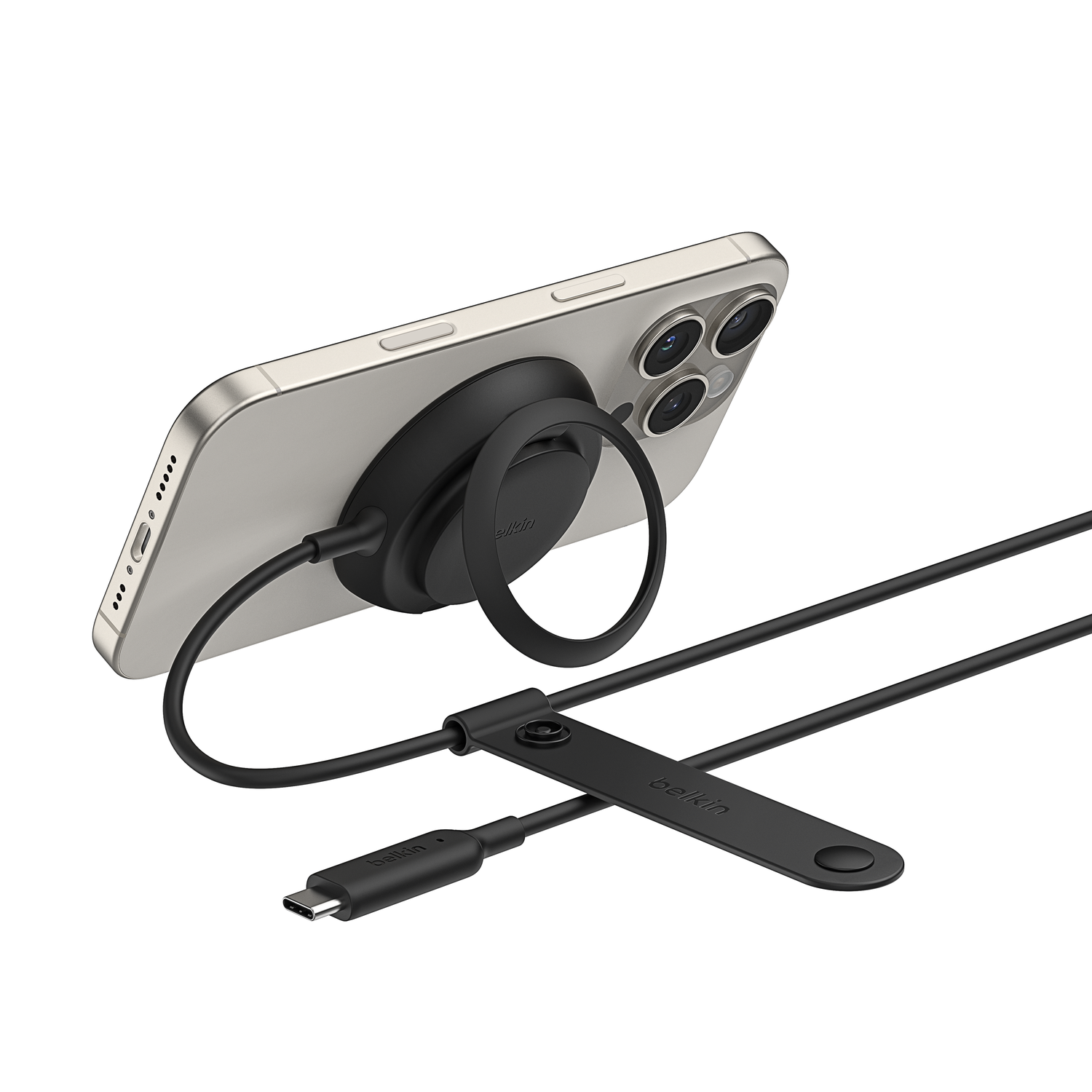 A silver smartphone with a black ring holder and charging cable.