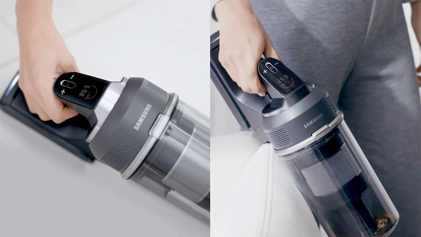Eine Hand hält einen Samsung Staubsauger auf weißem Hintergrund.