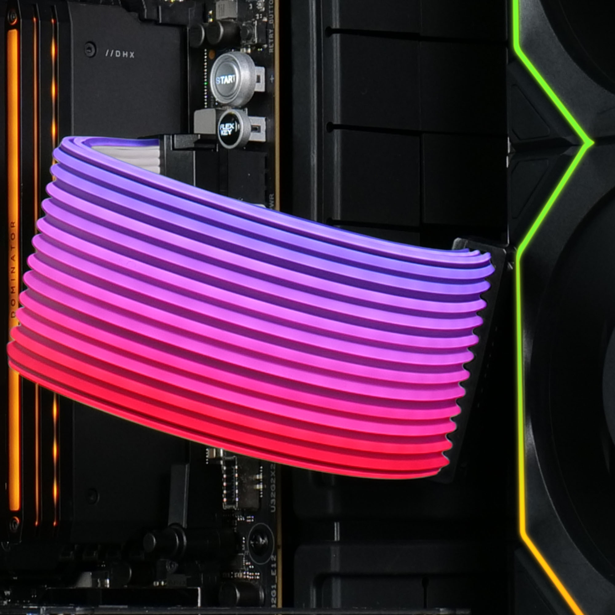Ein bunter RGB-Kabelstrang mit Lila- und Rottönen vor einem schwarzen Computer-Motherboard mit Lichtern.