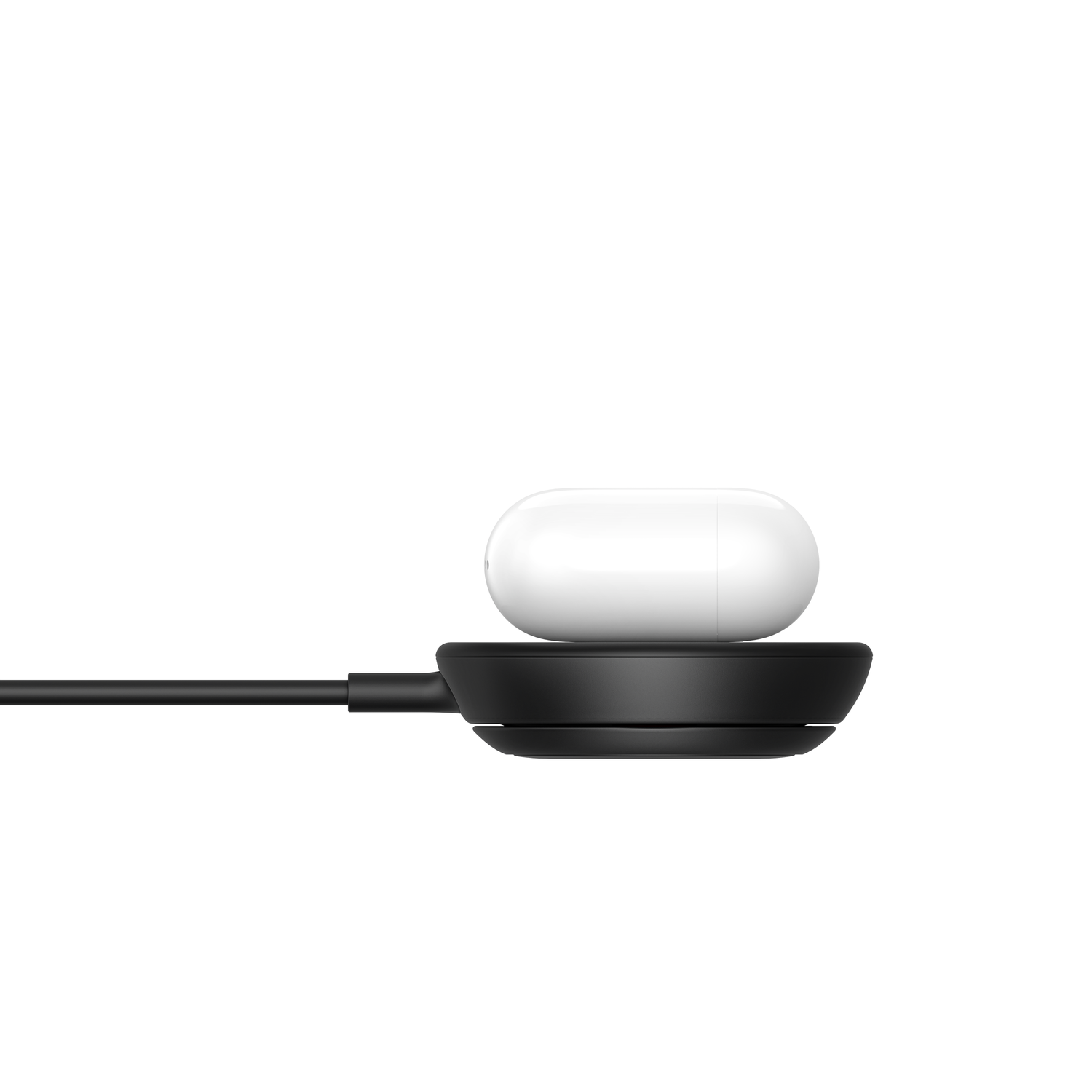 A white earbud charging case rests on a black charging base.