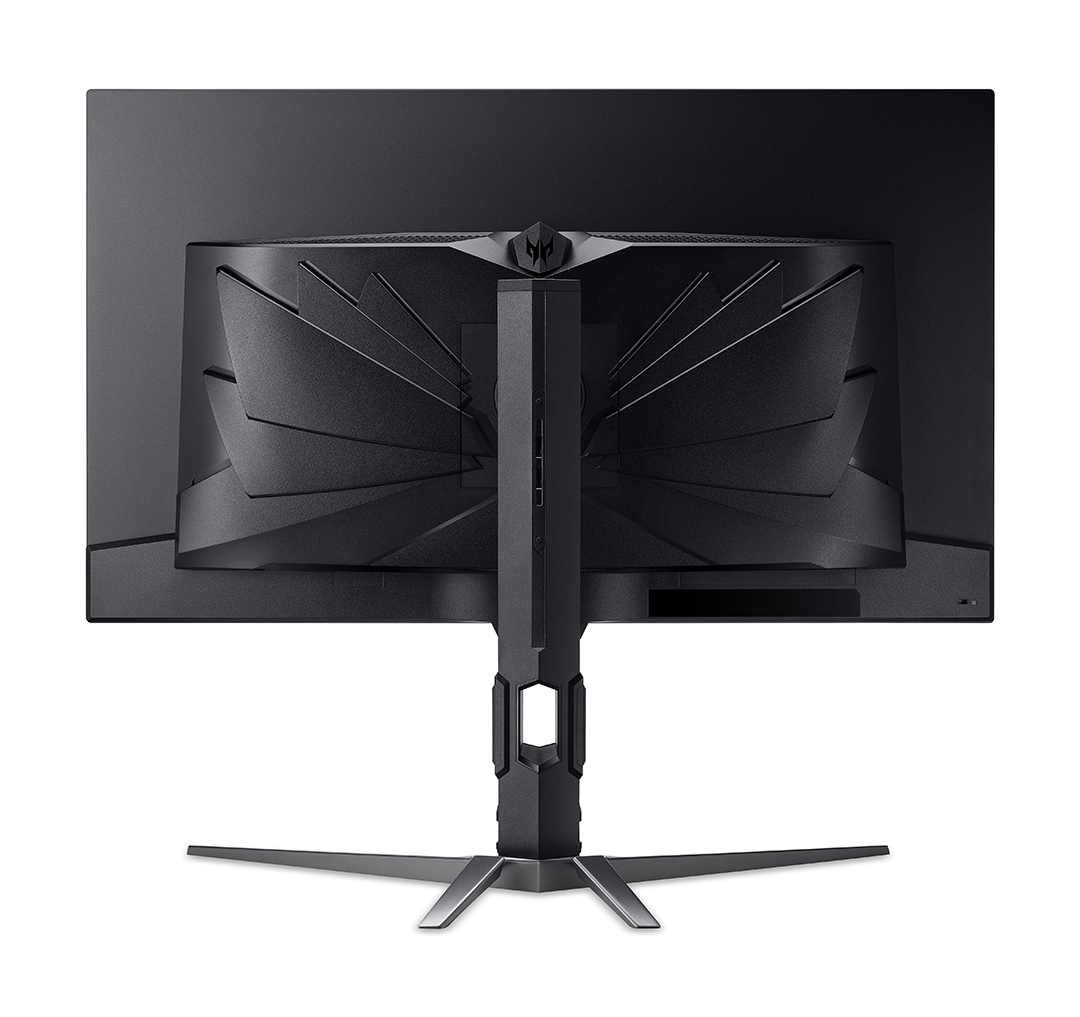 Fekete monitor hátulja, elegáns állvánnyal és szellőzőrésekkel.