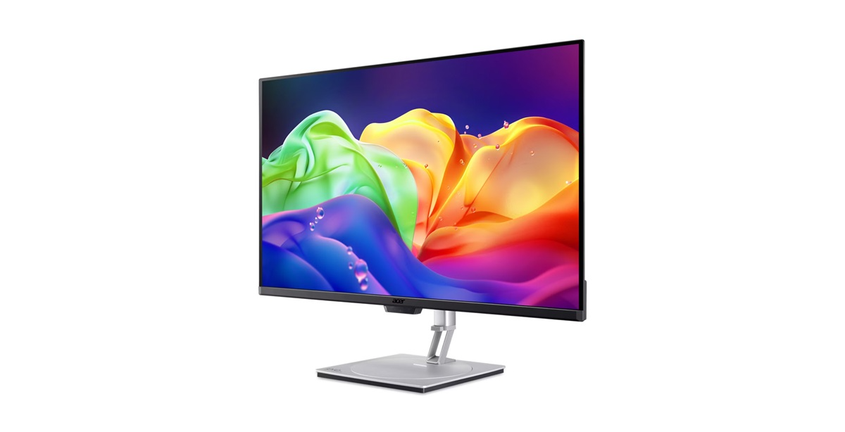 Egy modern monitor színes, absztrakt háttérrel.