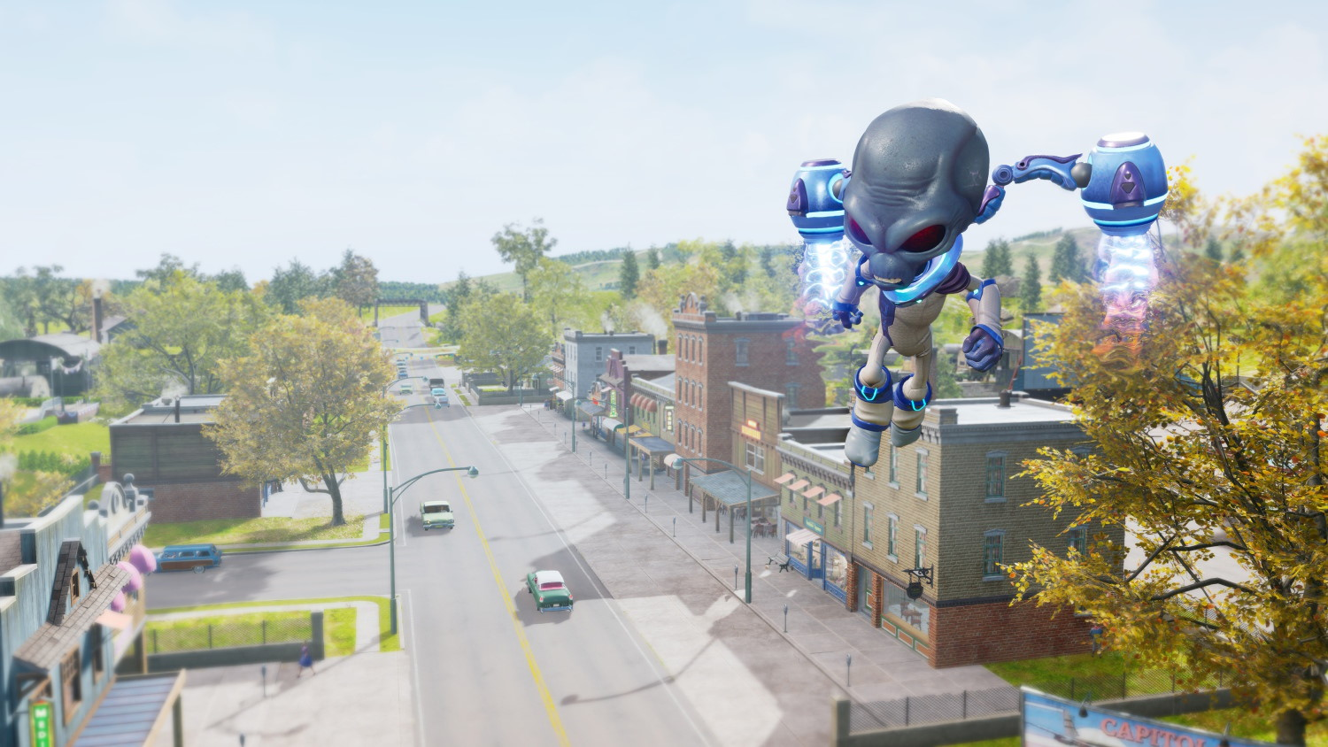 Un alien vole au-dessus d'une petite ville avec des arbres et des bâtiments.