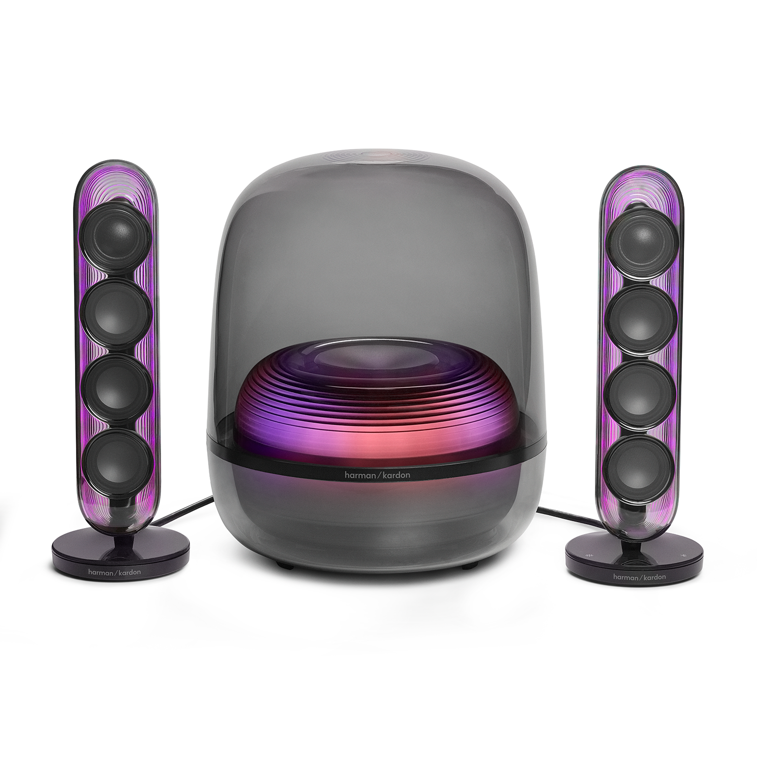 Dos altavoces delgados flanquean un subwoofer grande y translúcido con luces de colores.