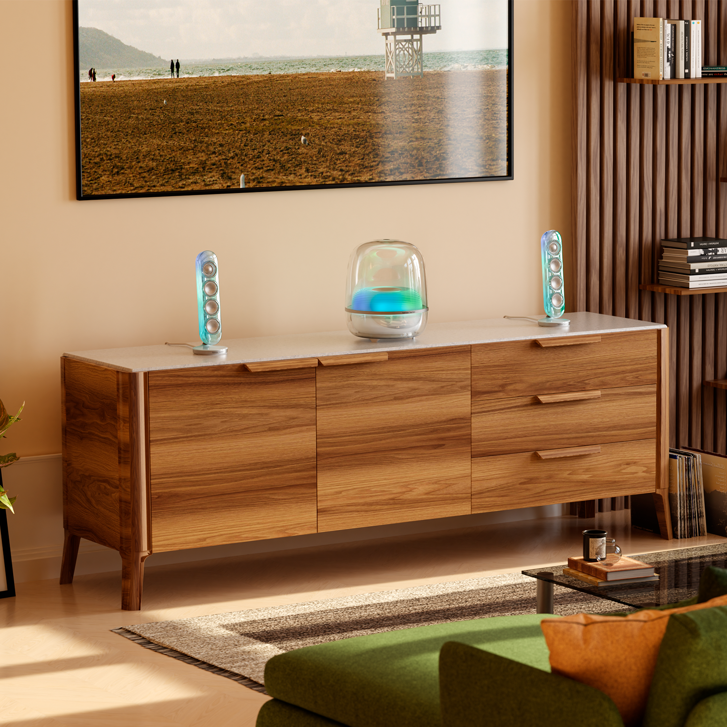 Una sala de estar con un televisor que muestra una escena de playa y dos altavoces iluminados.