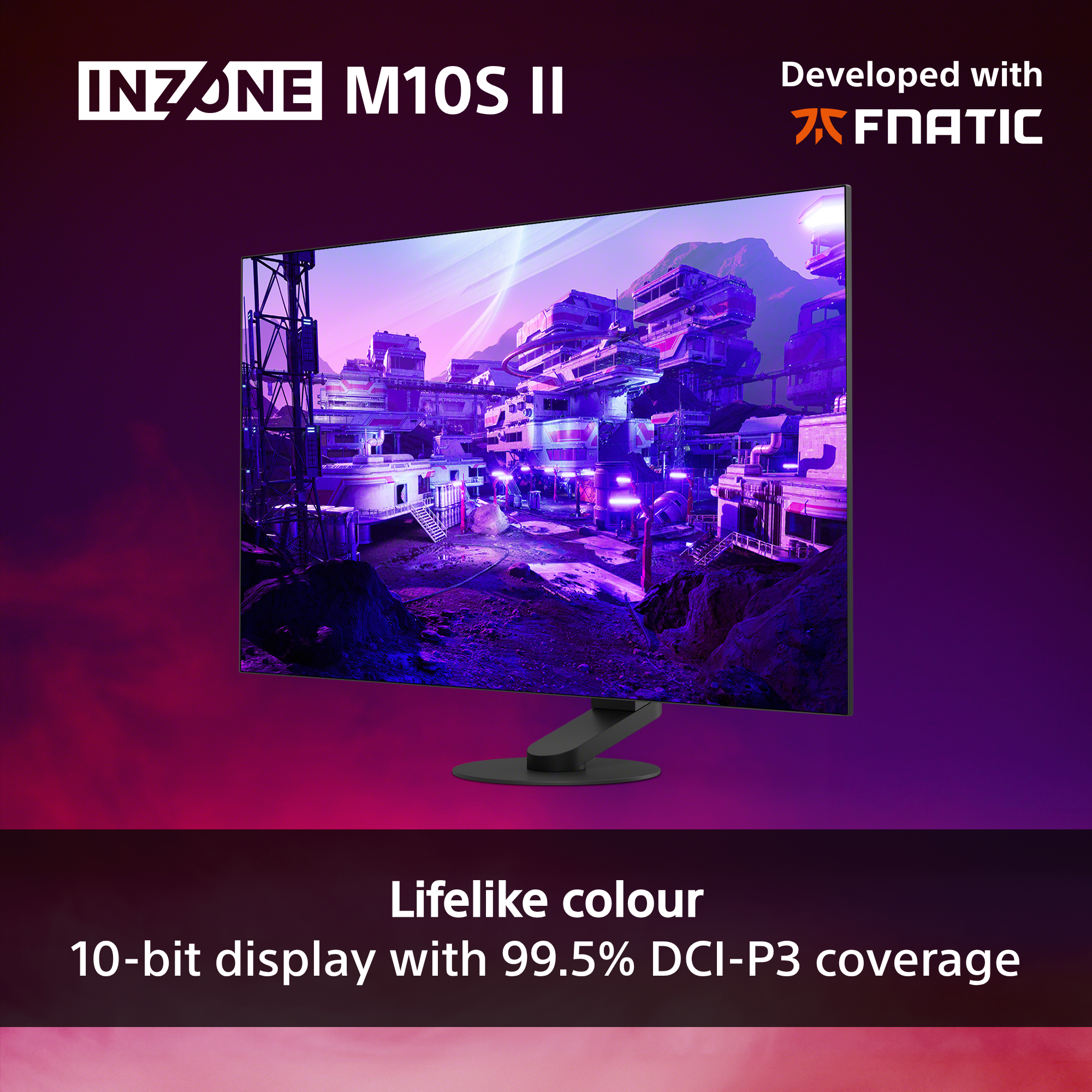 Un monitor da gaming mostra una città futuristica con testo sul colore.