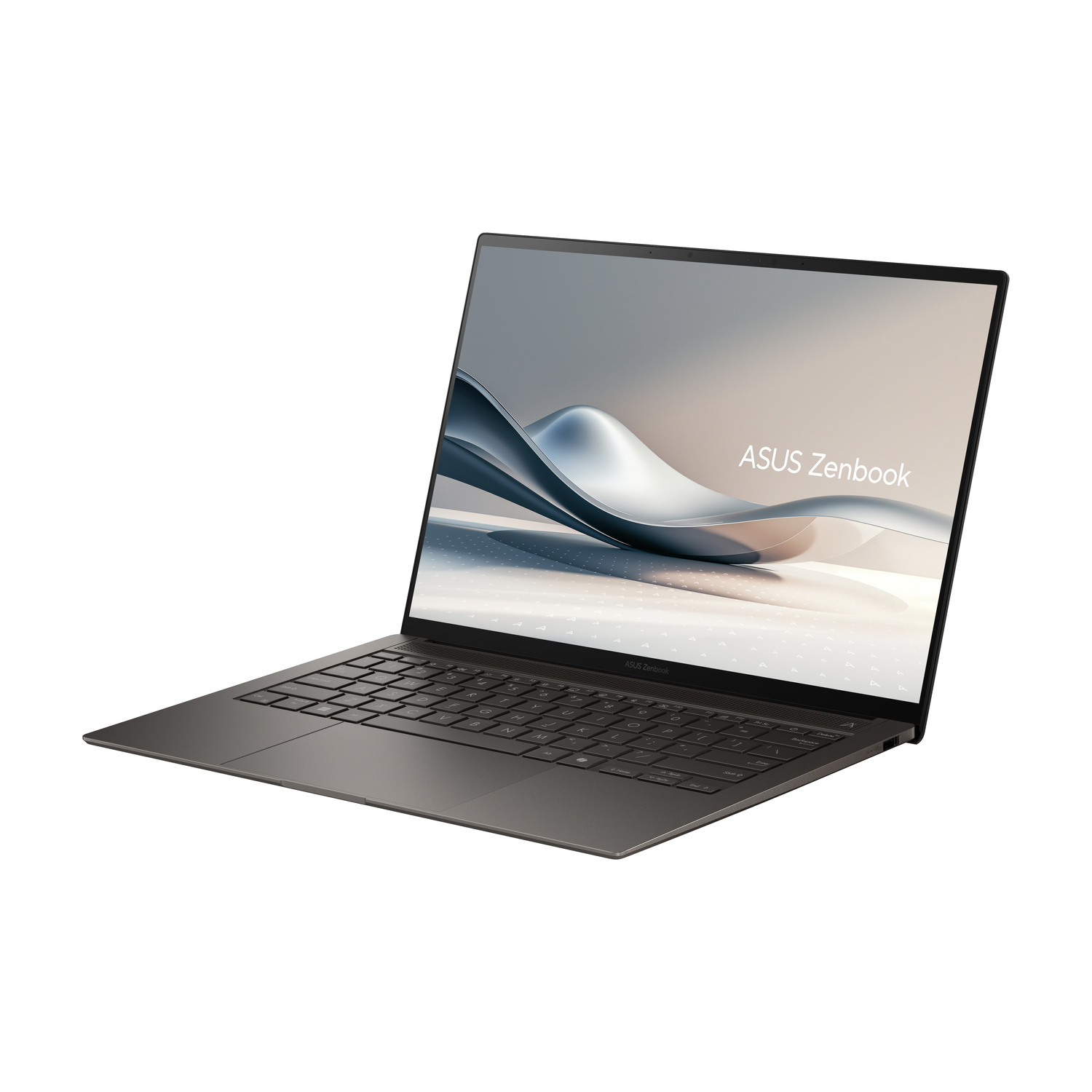 Un laptop scuro chiuso con il logo ASUS Zenbook sullo schermo.