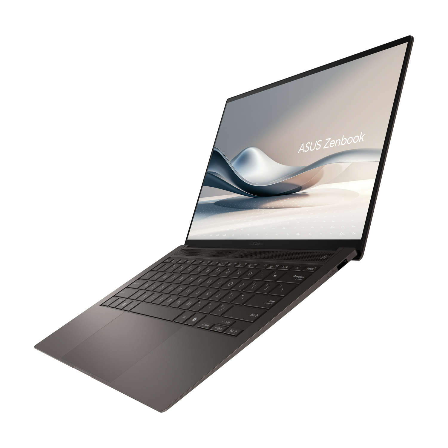 Un laptop ASUS Zenbook aperto e scuro con tastiera retroilluminata su sfondo bianco.
