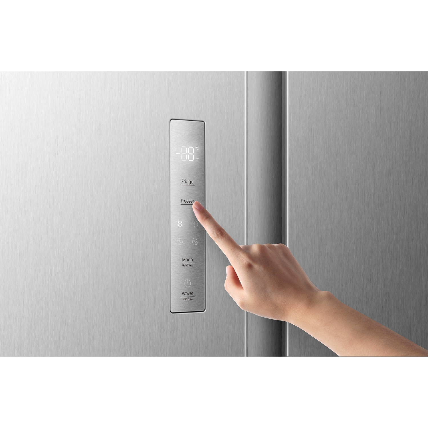 A hand touches a refrigerator control panel, selecting the freezer function.