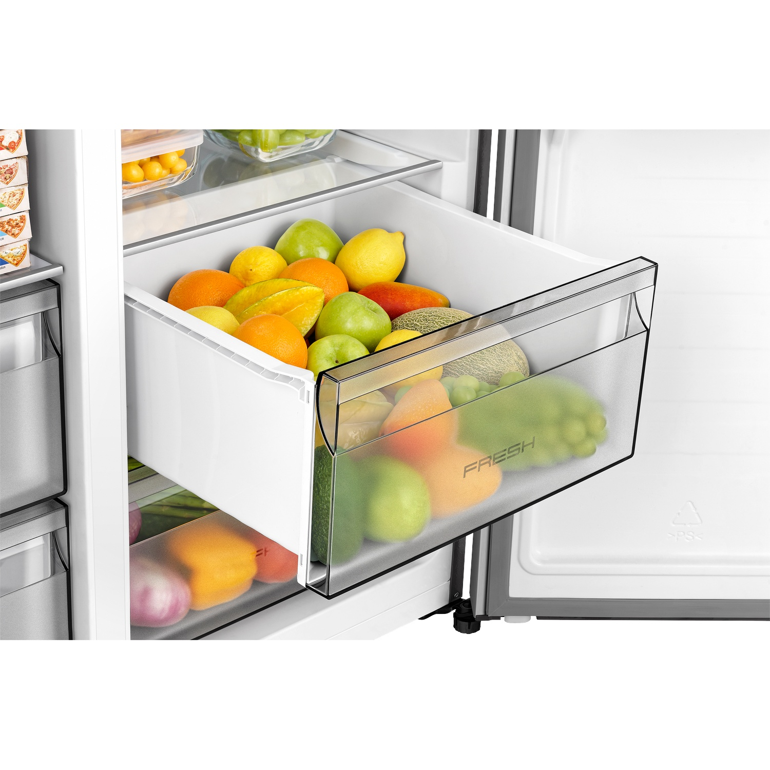 An open refrigerator drawer filled with apples, oranges, lemons, and melons.