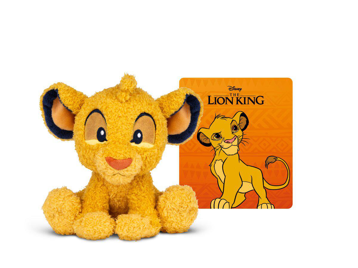 Ein Plüsch-Simba-Spielzeug sitzt links von einem König der Löwen-Logo mit jungem Simba.