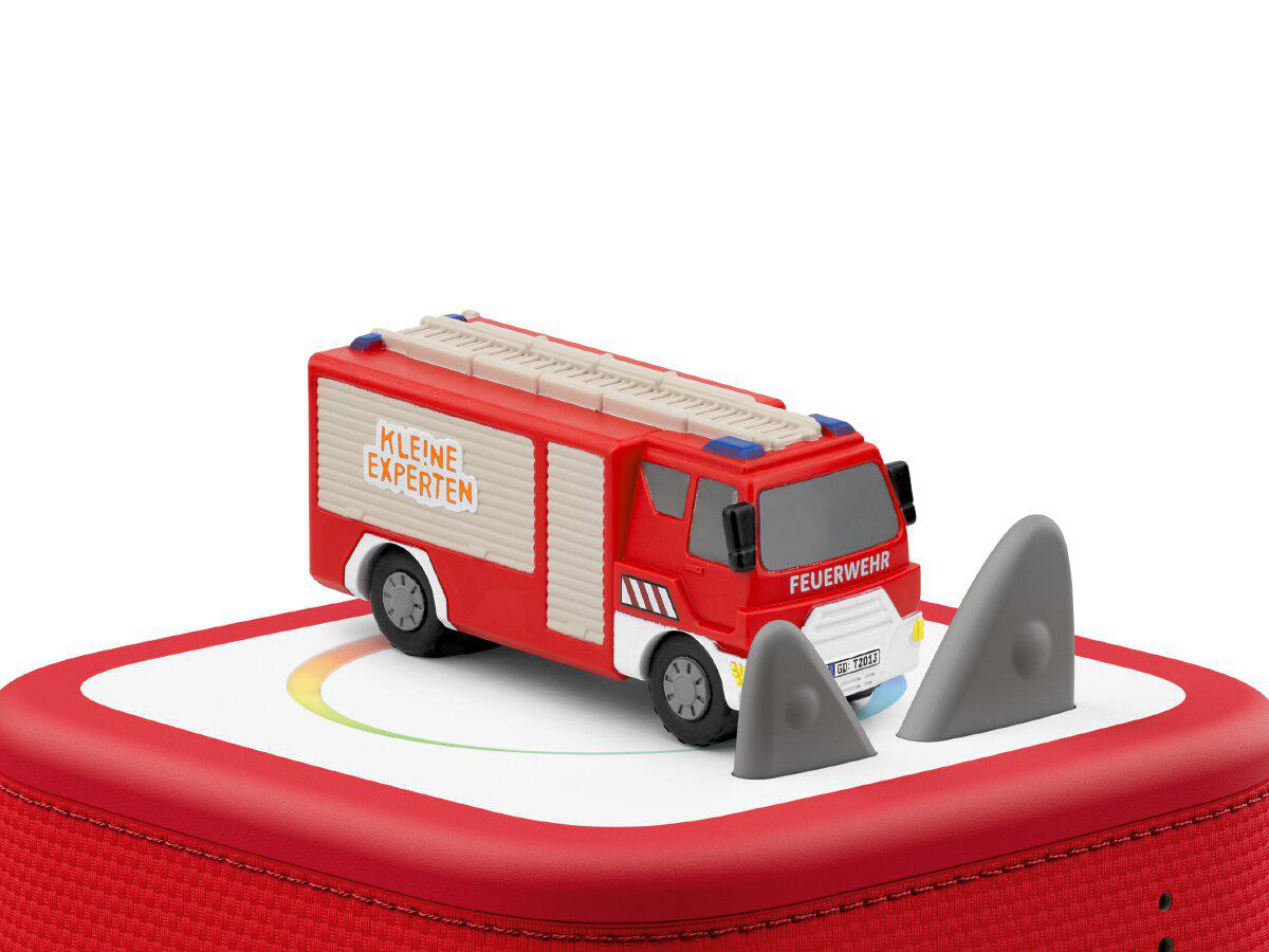 Ein rotes Spielzeug-Feuerwehrauto mit 