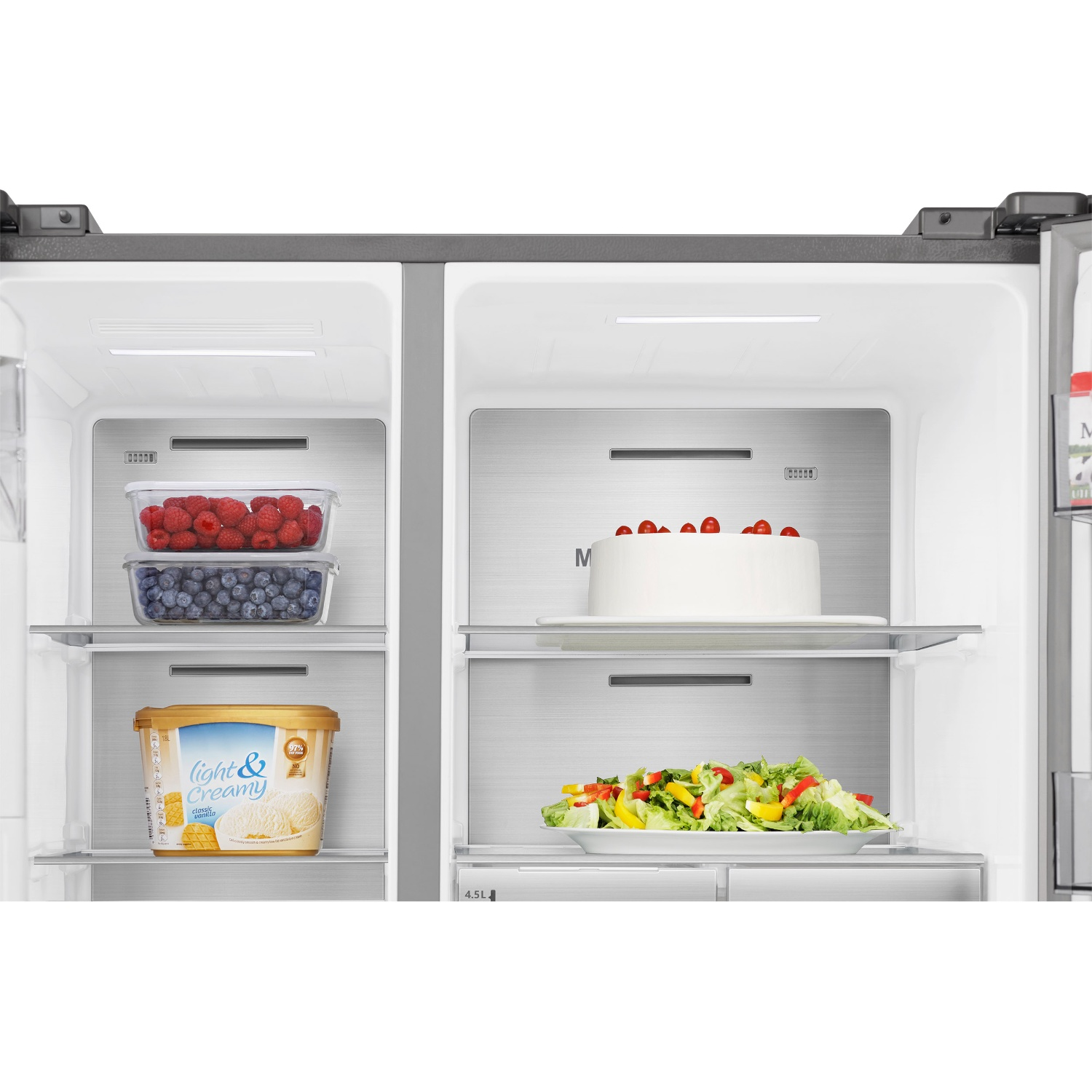 Refrigerator interior with berries, ice cream, and salad. Left side has berries.