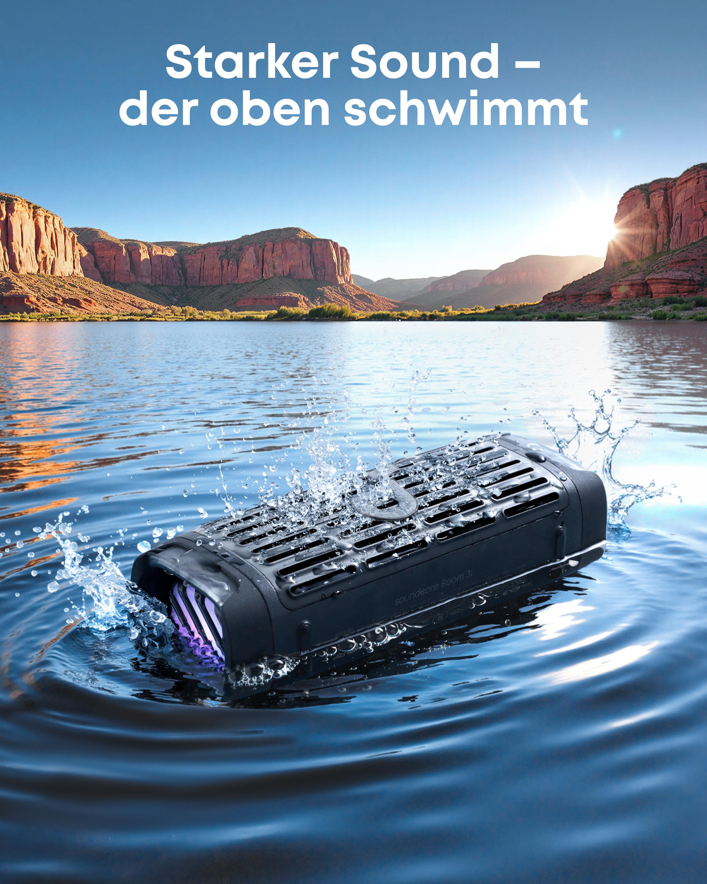 Ein schwarzer Lautsprecher schwimmt im Wasser vor einer Berglandschaft.
