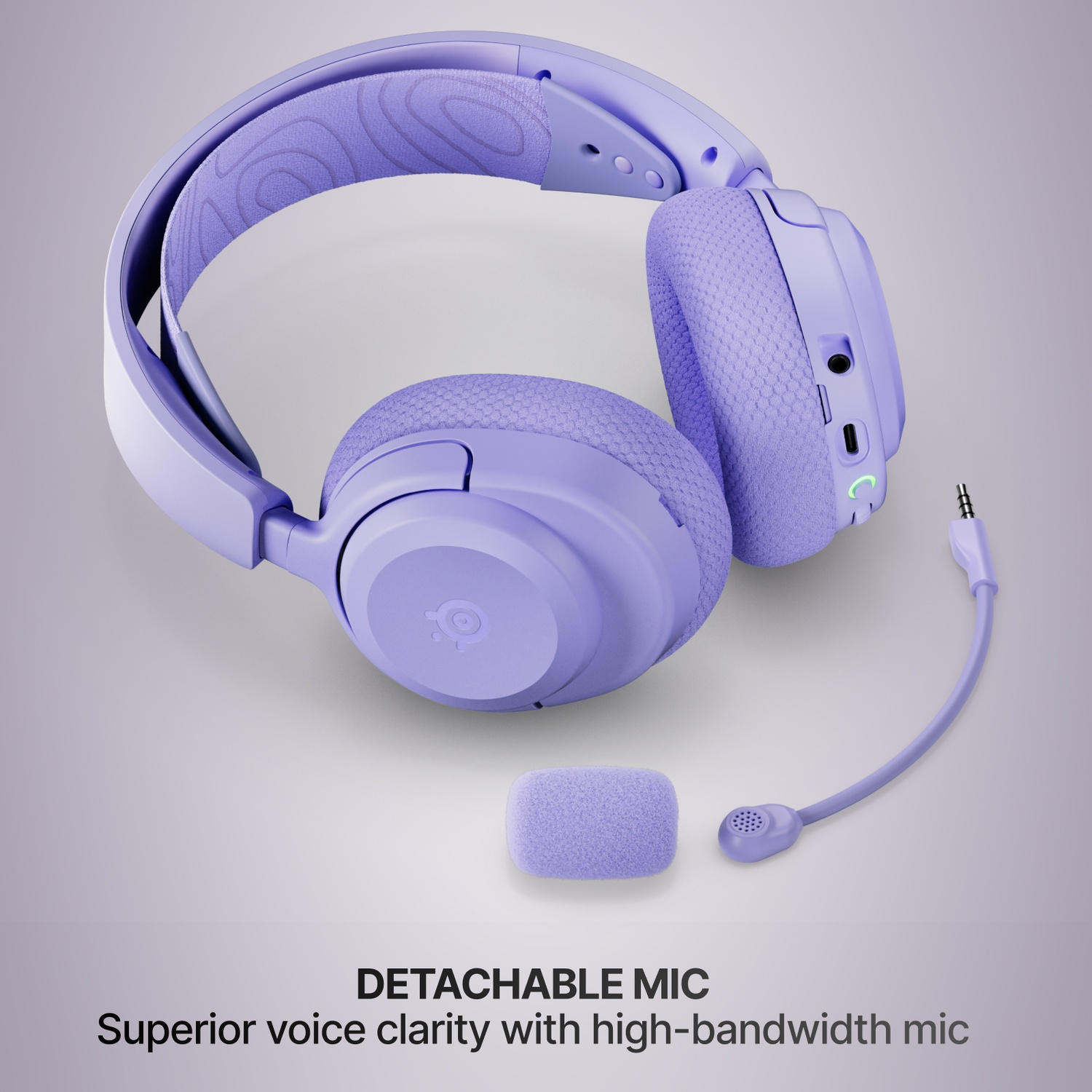 Casque lavande avec microphone détachable et bandeau rembourré, sur fond clair.