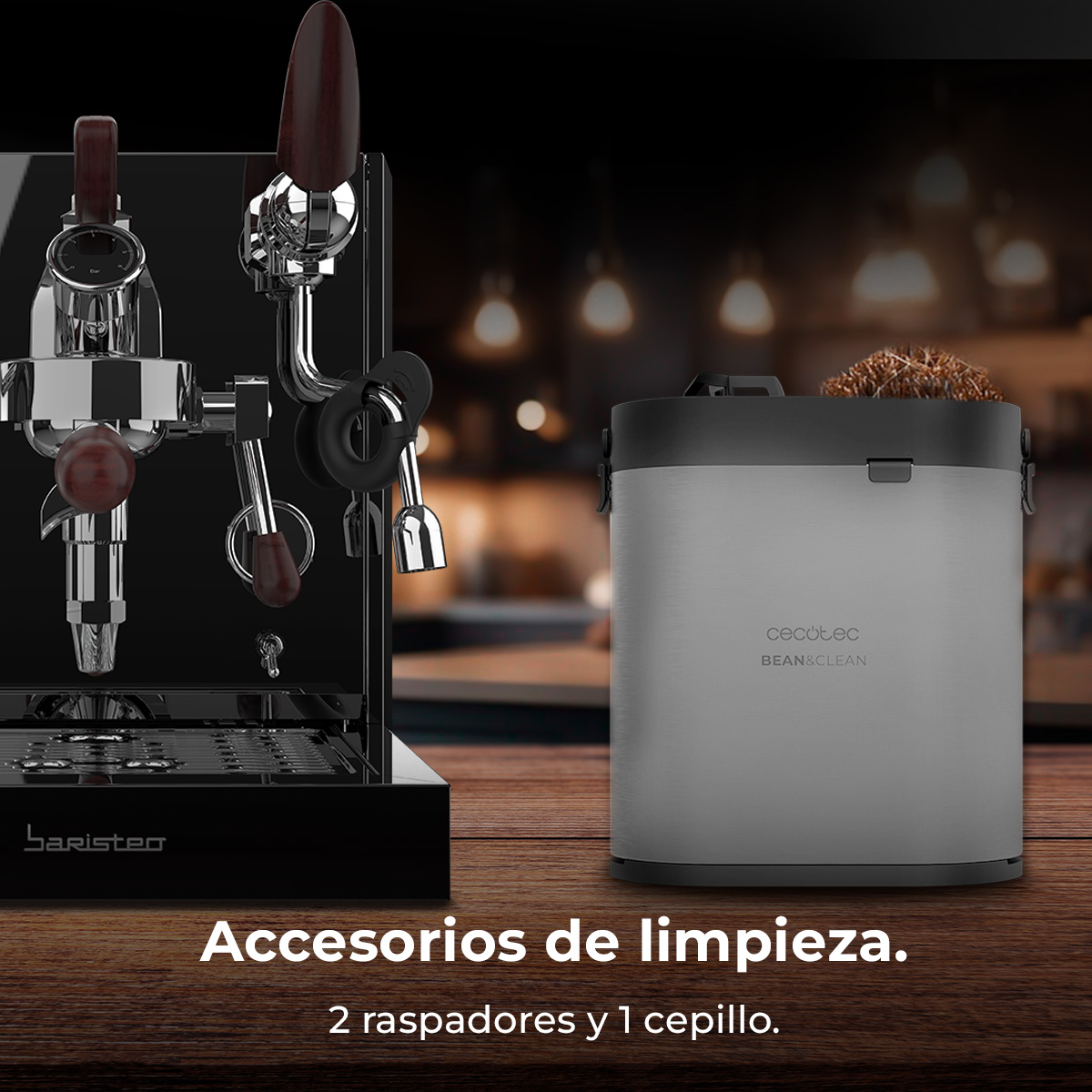 Máquina de espresso y cubo de limpieza con cepillos sobre mesa.