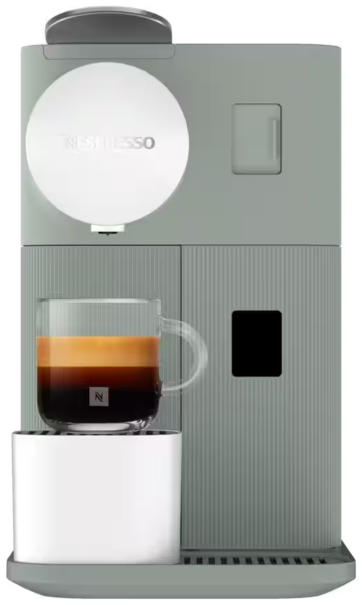 Szürke Nespresso gép egy csésze eszpresszóval és krémes habbal.