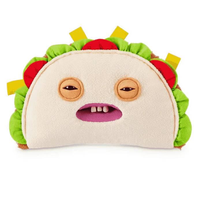 Un taco de peluche con cara graciosa, ojos, boca y dientes.