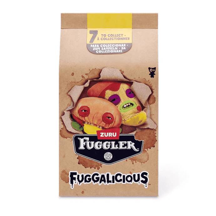 Pelüches Fugglers en una caja de cartón con estampados coloridos.