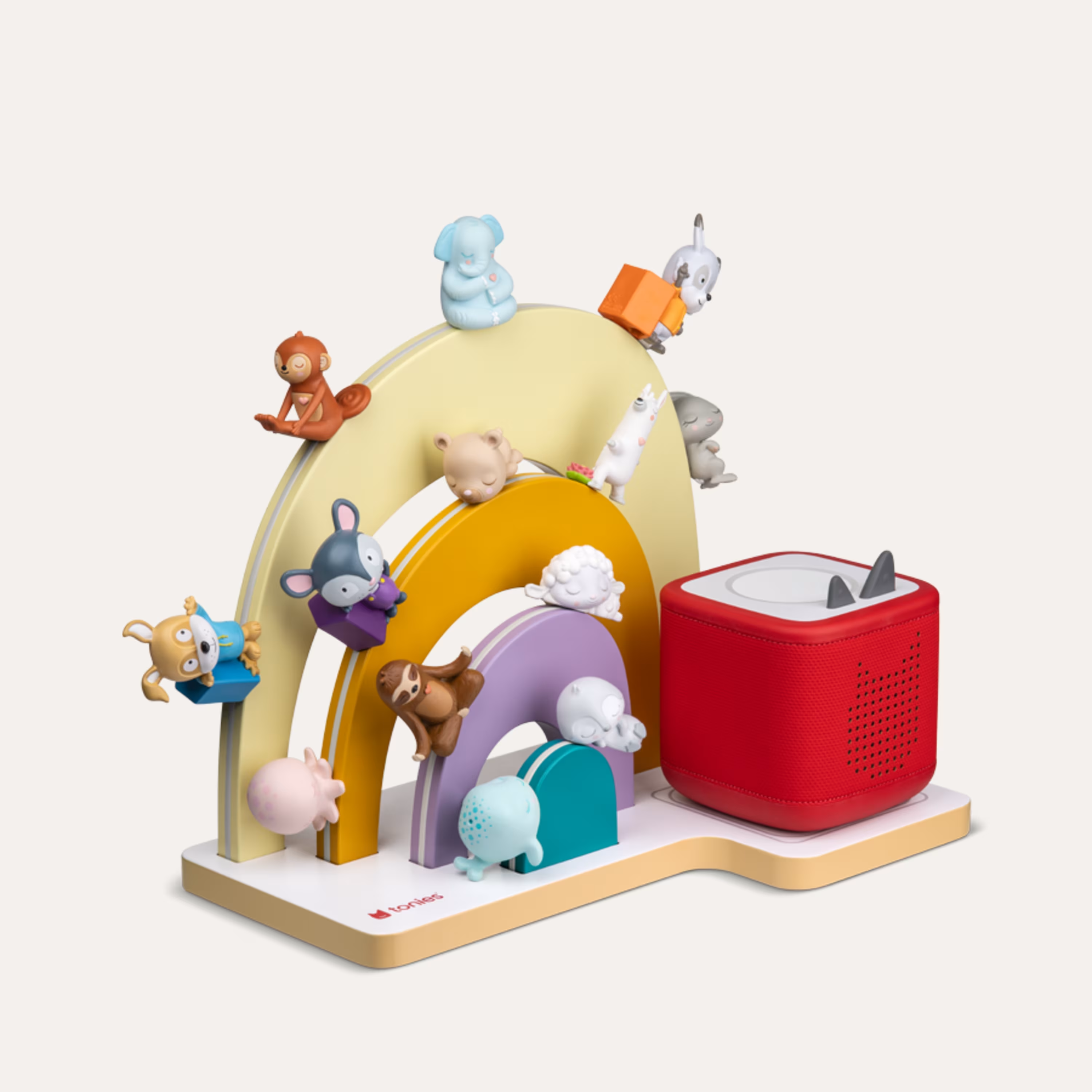 Bunte Spielzeug-Regenbogen mit Tierfiguren und rotem Lautsprecher.