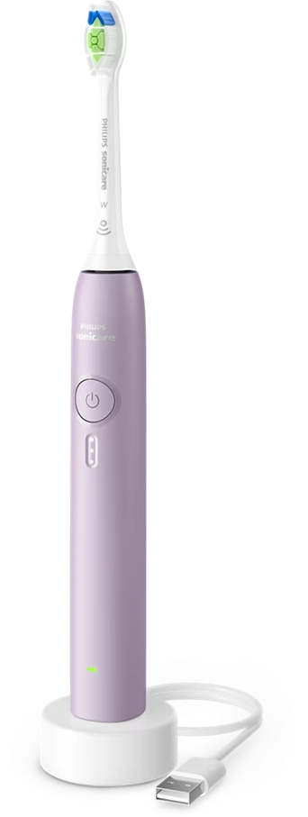 Lila elektromos fogkefe töltőállvánnyal és USB-kábellel.