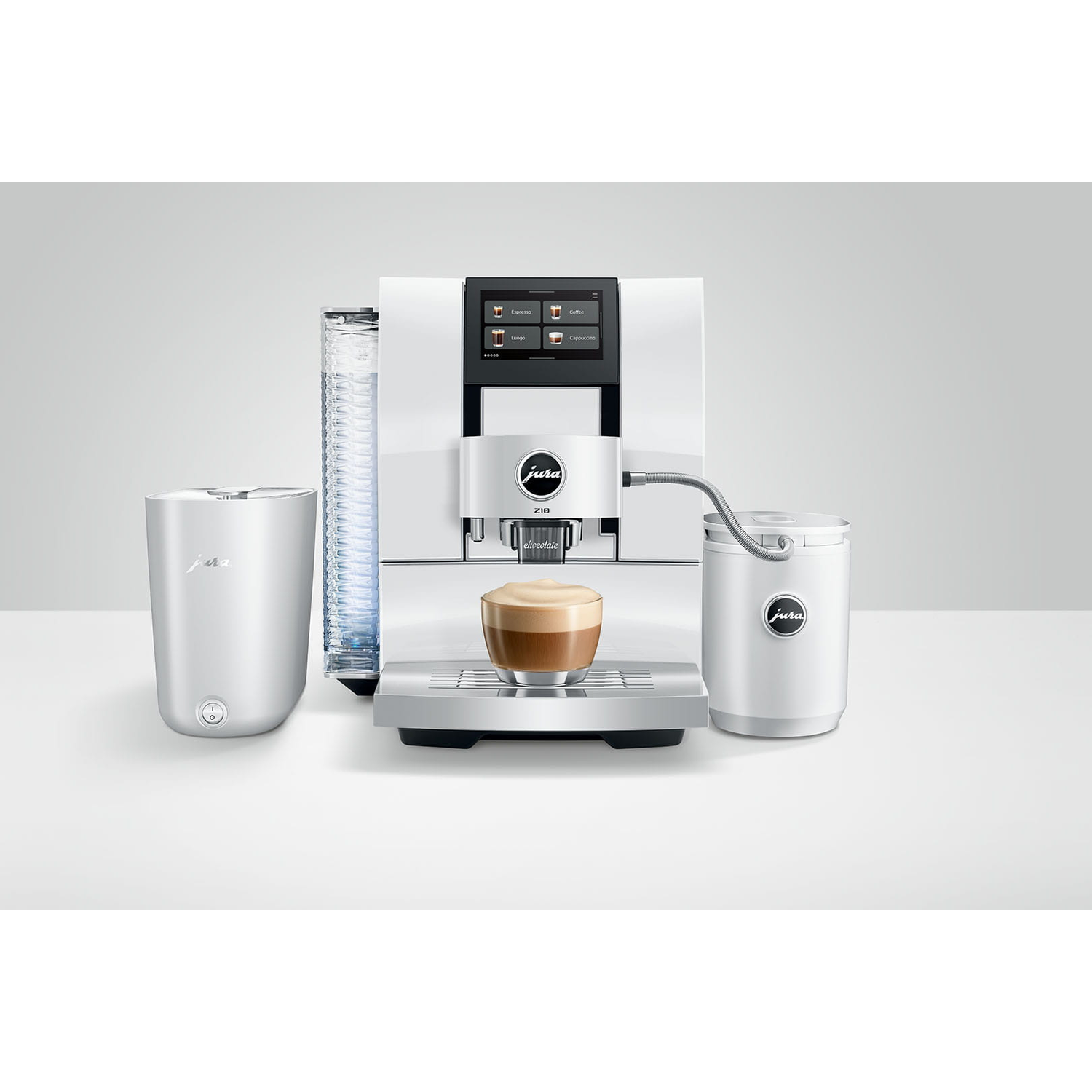 Witte koffiemachine met melkreservoir, watertank en kopje koffie.