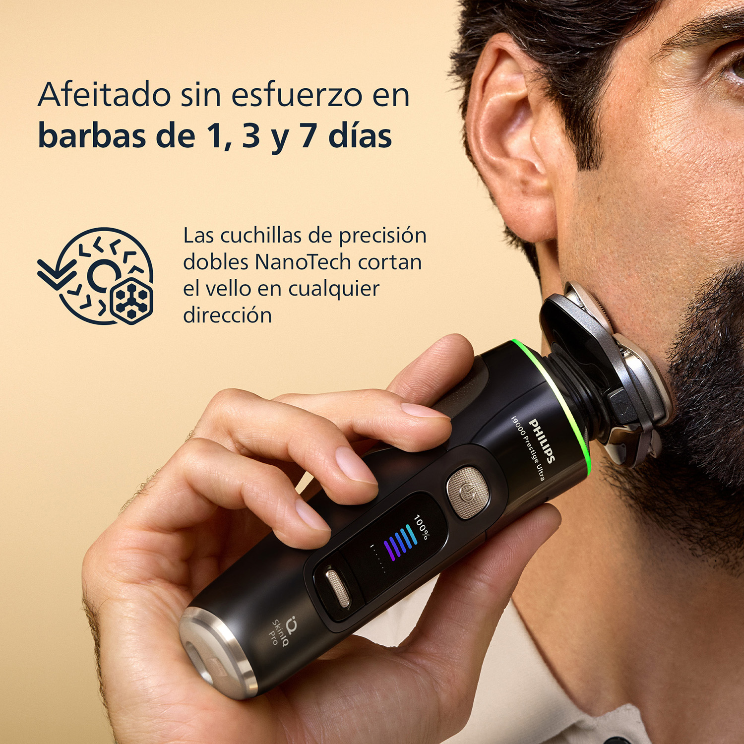Un hombre se afeita el cuello con una afeitadora Philips negra. Primer plano de la afeitadora.