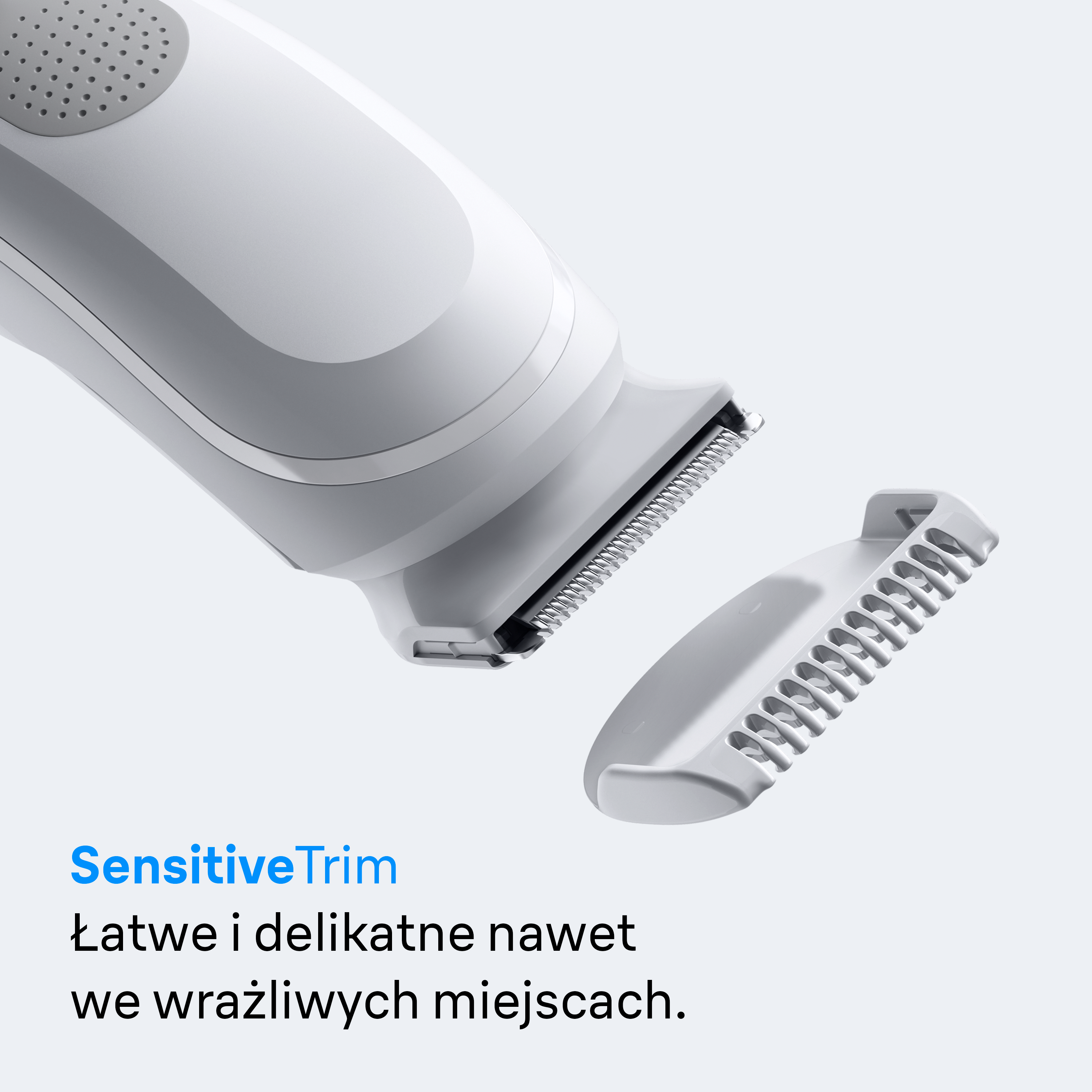 Biała maszynka do strzyżenia z odłączoną nasadką na jasnym tle.