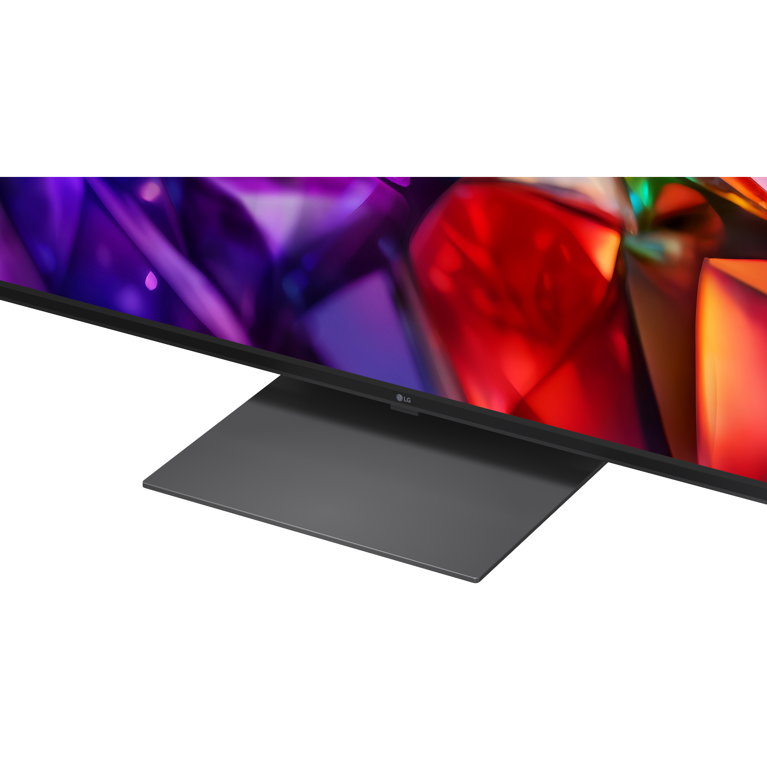 An LG TV with a dark stand and a colorful, abstract background.