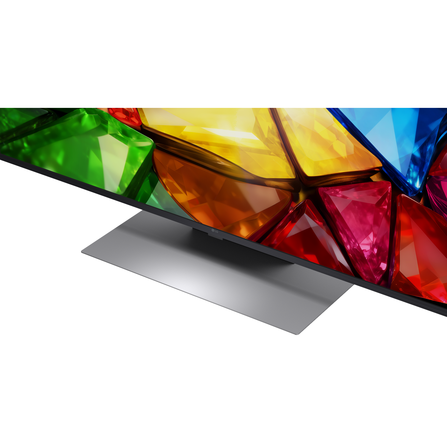 A modern TV displays a vibrant screen of colorful, faceted geometric shapes on a black background.