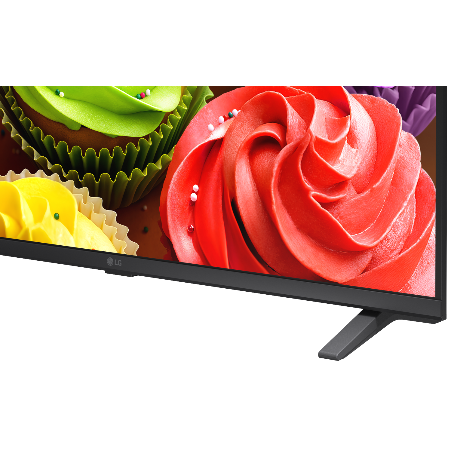 Close-up of colorful cupcakes with frosting and sprinkles displayed on a TV screen.